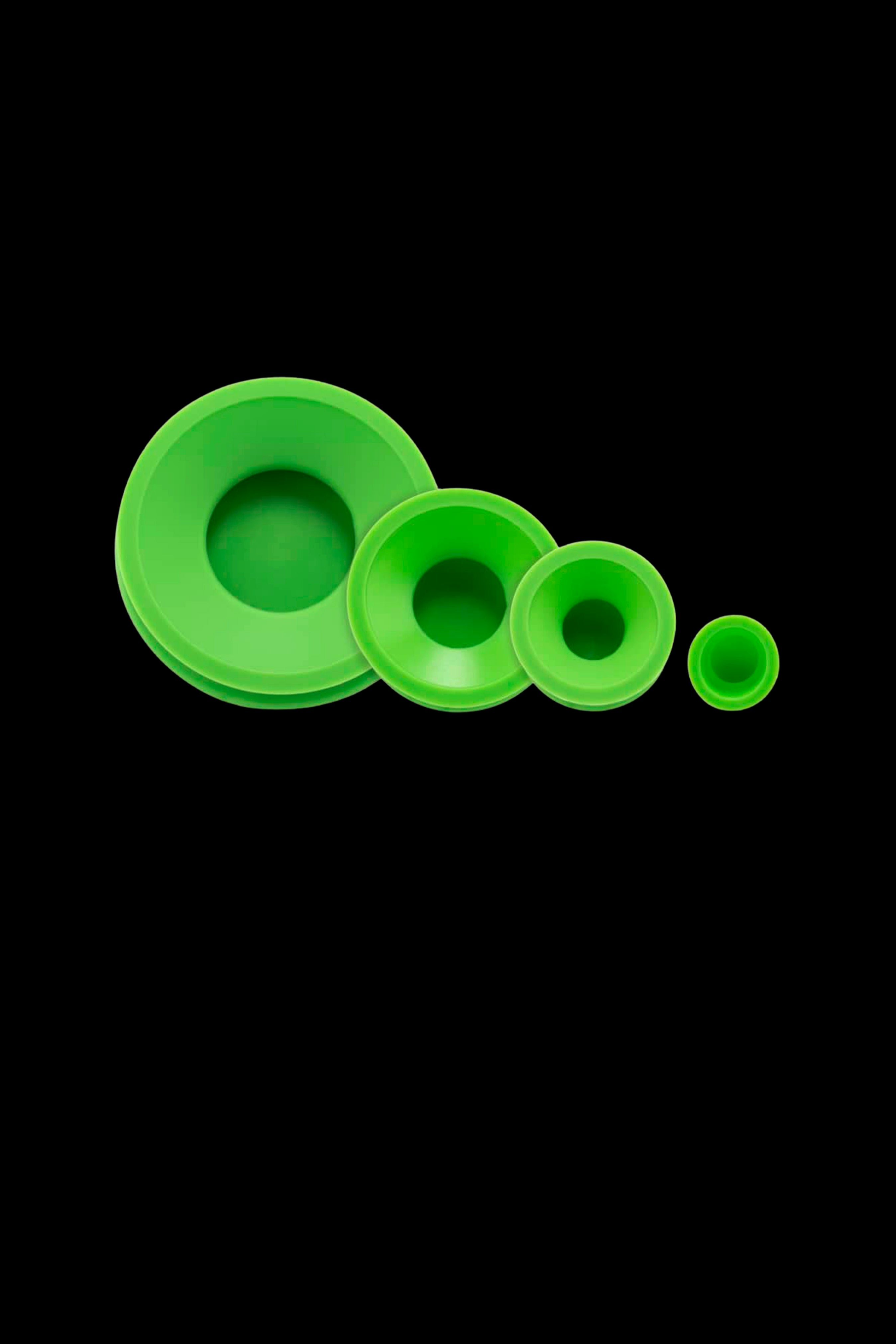Angled front view of four bright green Ooze Resolution Caps Cleaning Caps nested left-to-right on a black background.