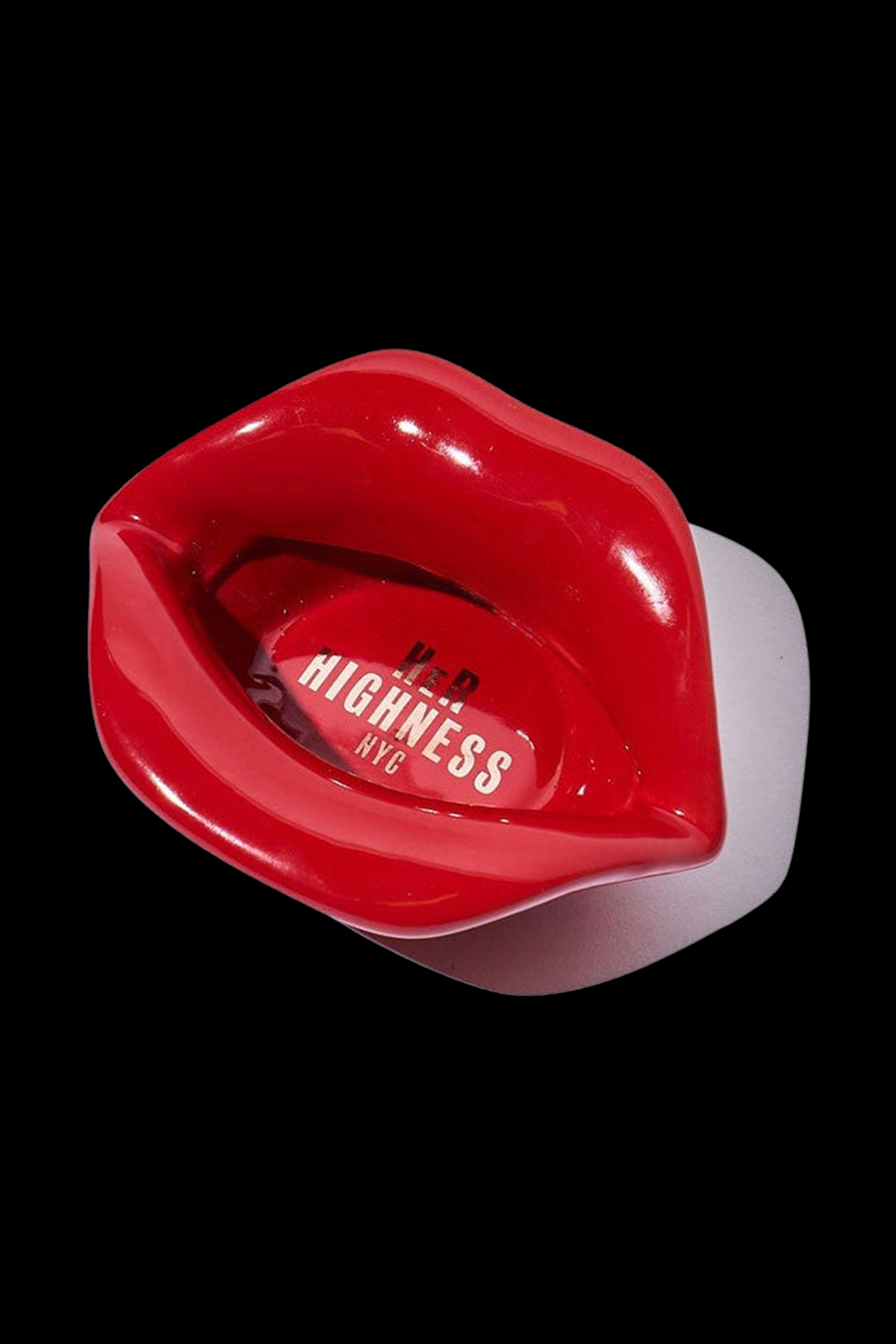 Red, lips-shaped cannabis pipe with "Highness NYC" branding.