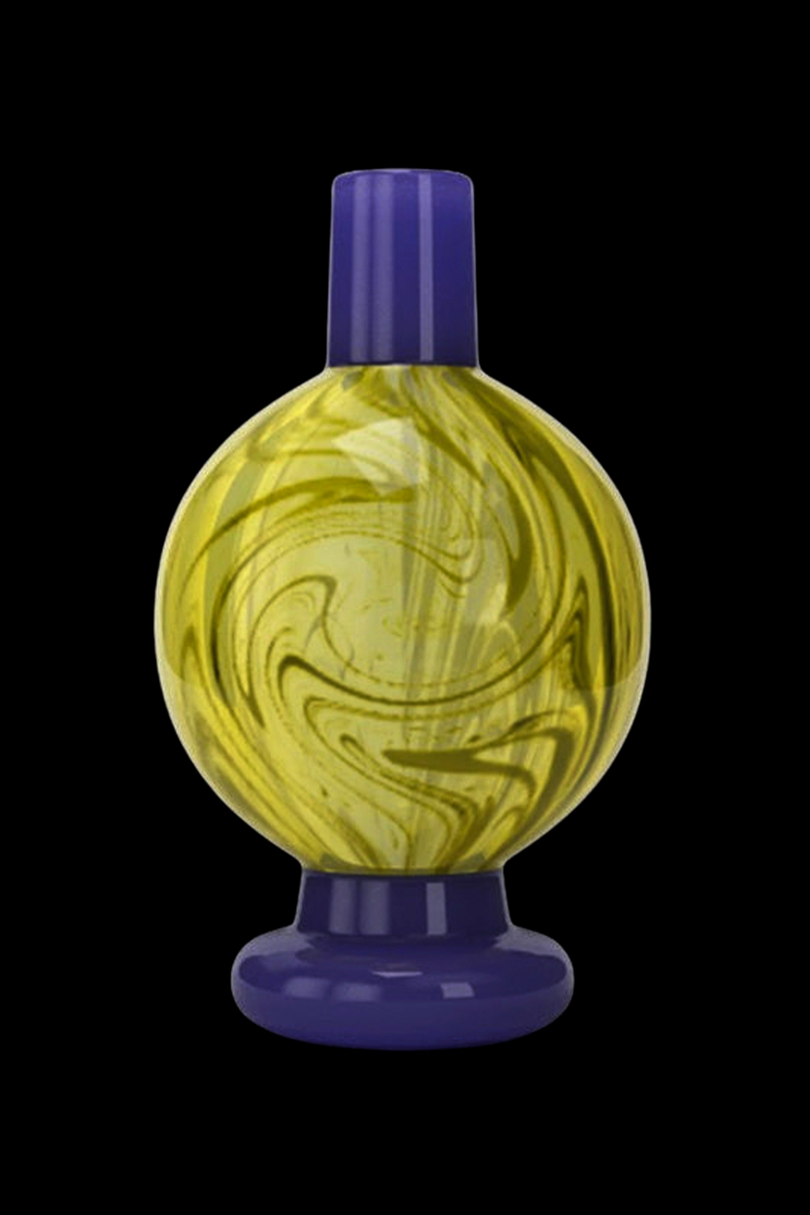 Swirled yellow and white glass bubbler with a blue mouthpiece and base, isolated on black.