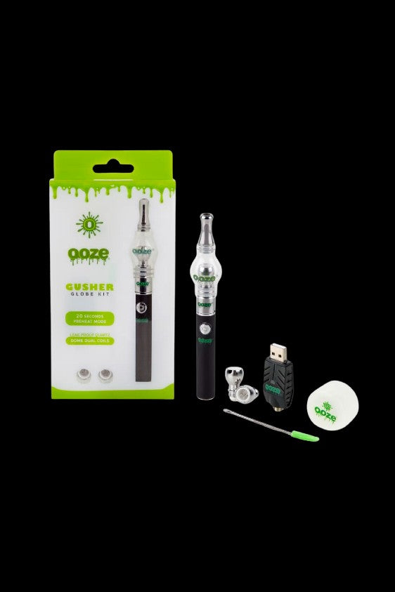 Ooze Crusher Globe Kit, a cannabis concentrate vaporizer with accompanying accessories including a charging cable and dab tool, displayed in its packaging.