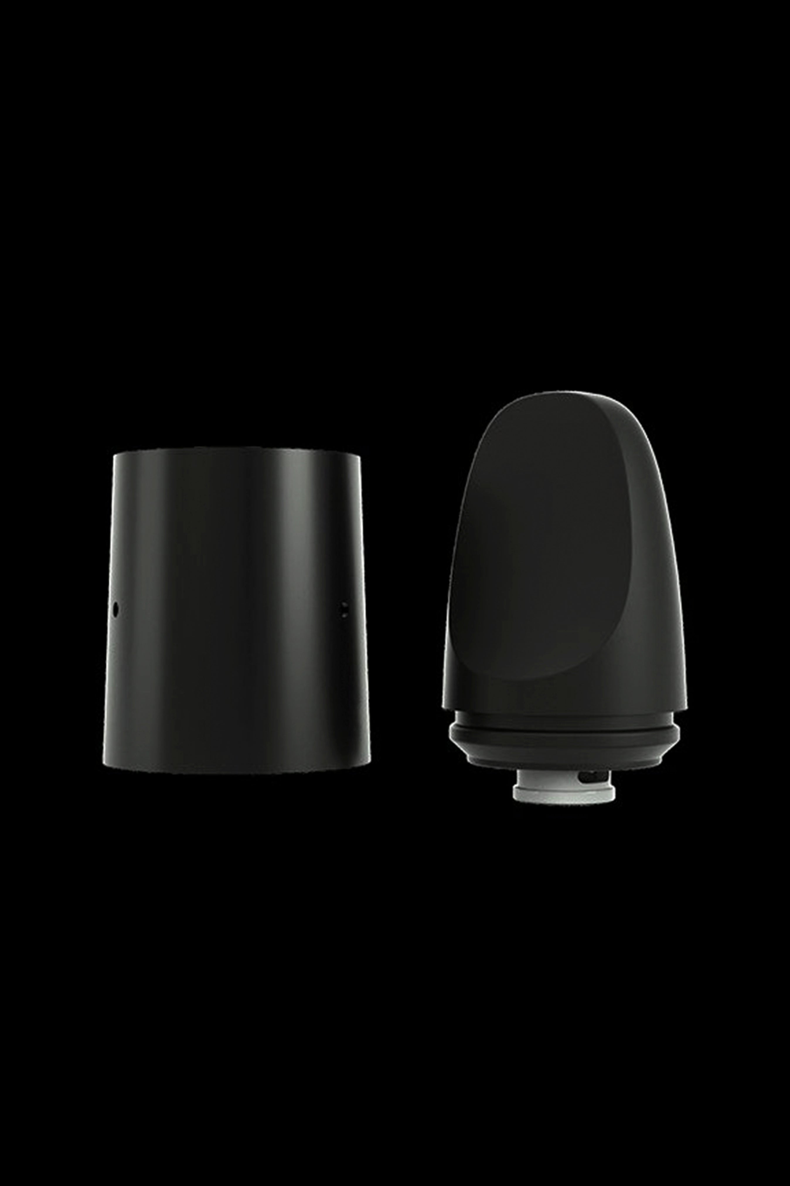 Black cannabis oil vape cartridge components, disassembled.