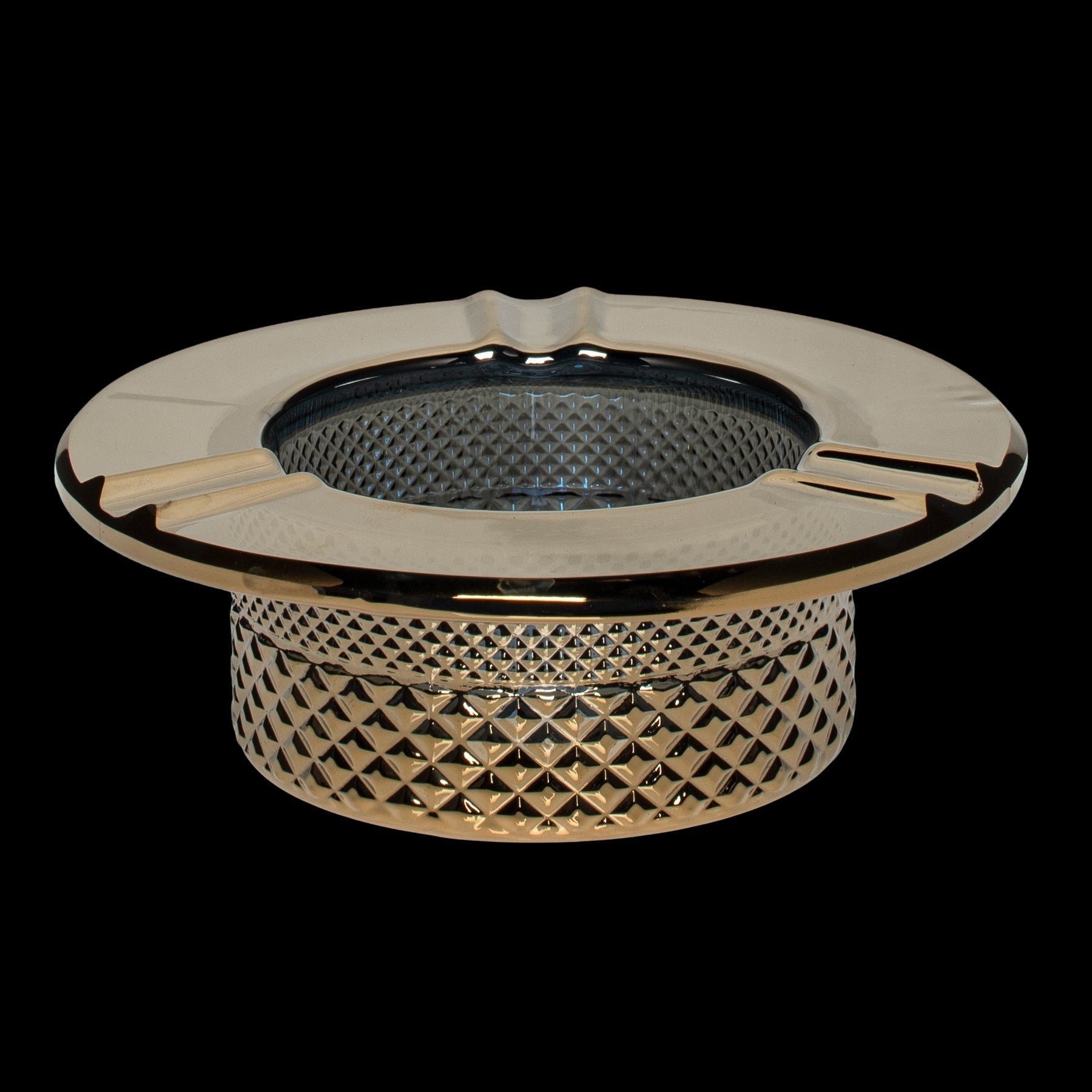 Gold ashtray with textured detailing, designed for cannabis use.