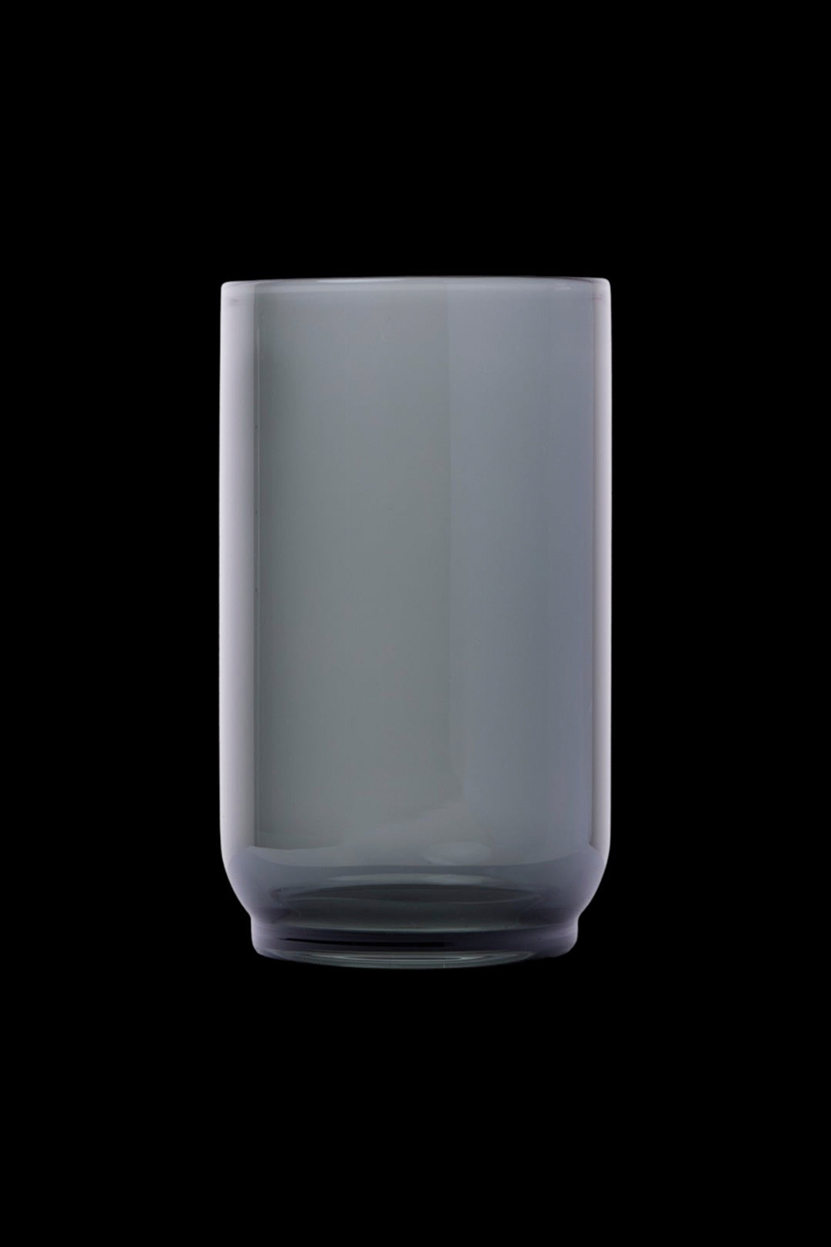 Frosted glass smoking pipe against a black background.