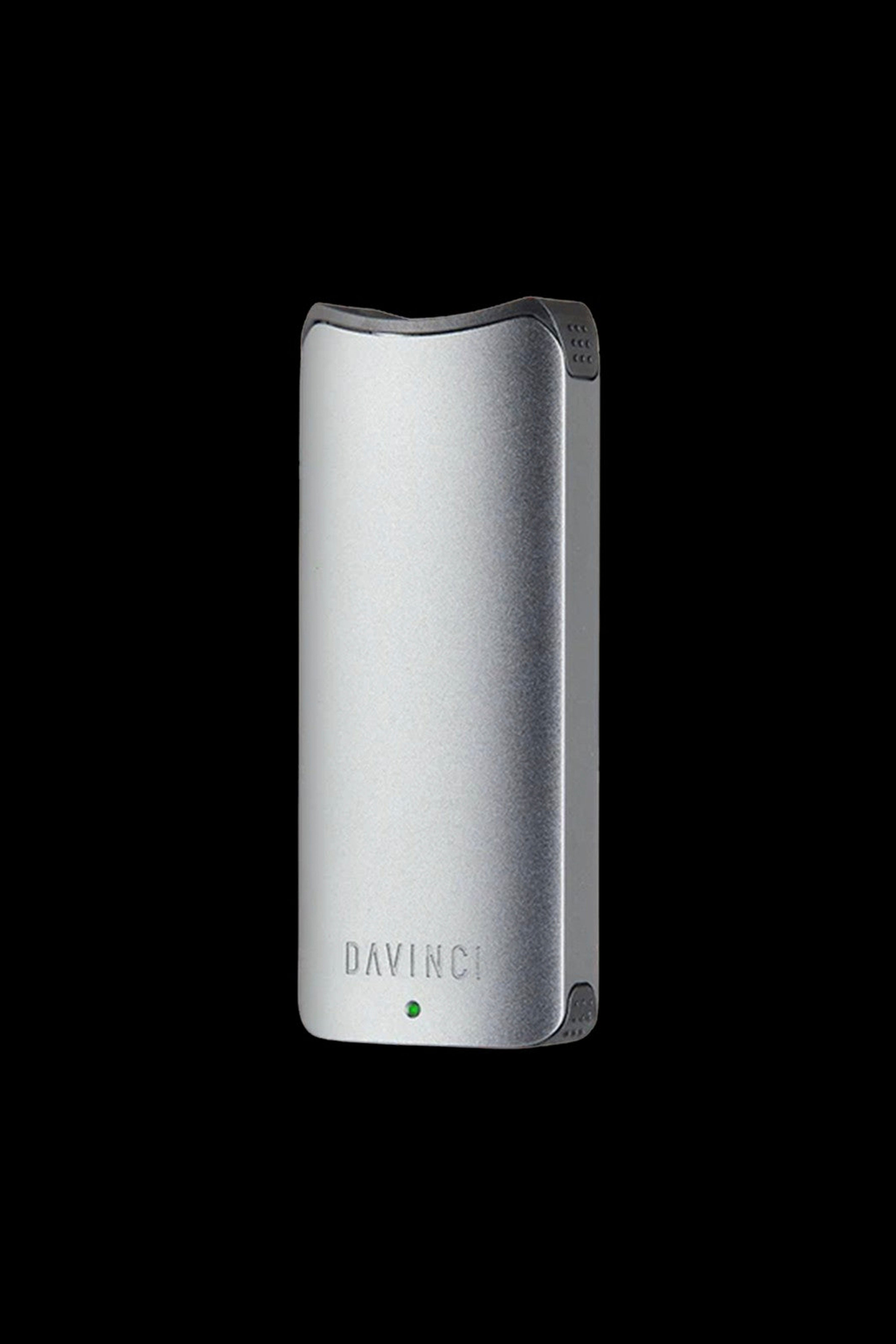 Silver DaVinci IQ2 vaporizer pen against a black background.