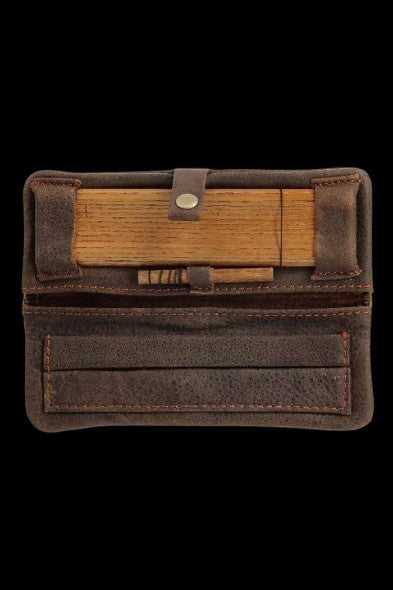 Brown leather cannabis smell-proof case open, revealing wooden storage compartments.