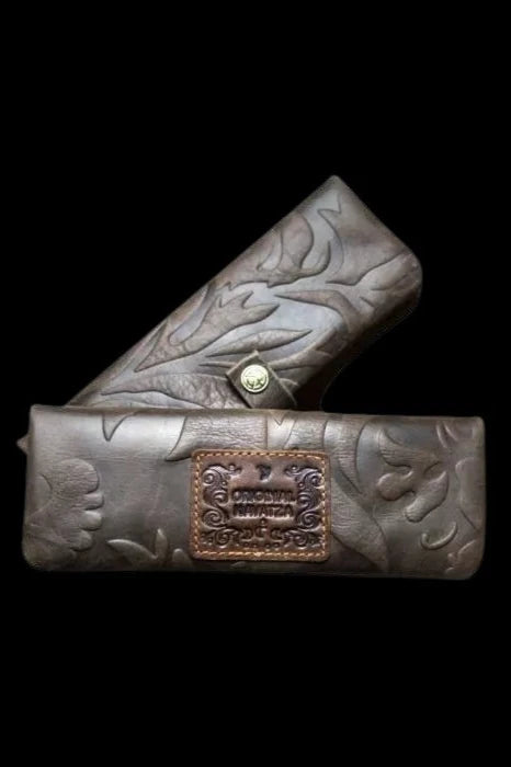 Embossed leather smell-proof case for cannabis accessories, featuring a floral pattern and “Original Stashaz” branding.
