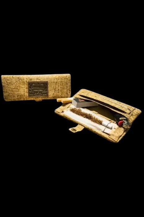 Gold-textured cannabis case open, displaying a rolled joint and additional papers.