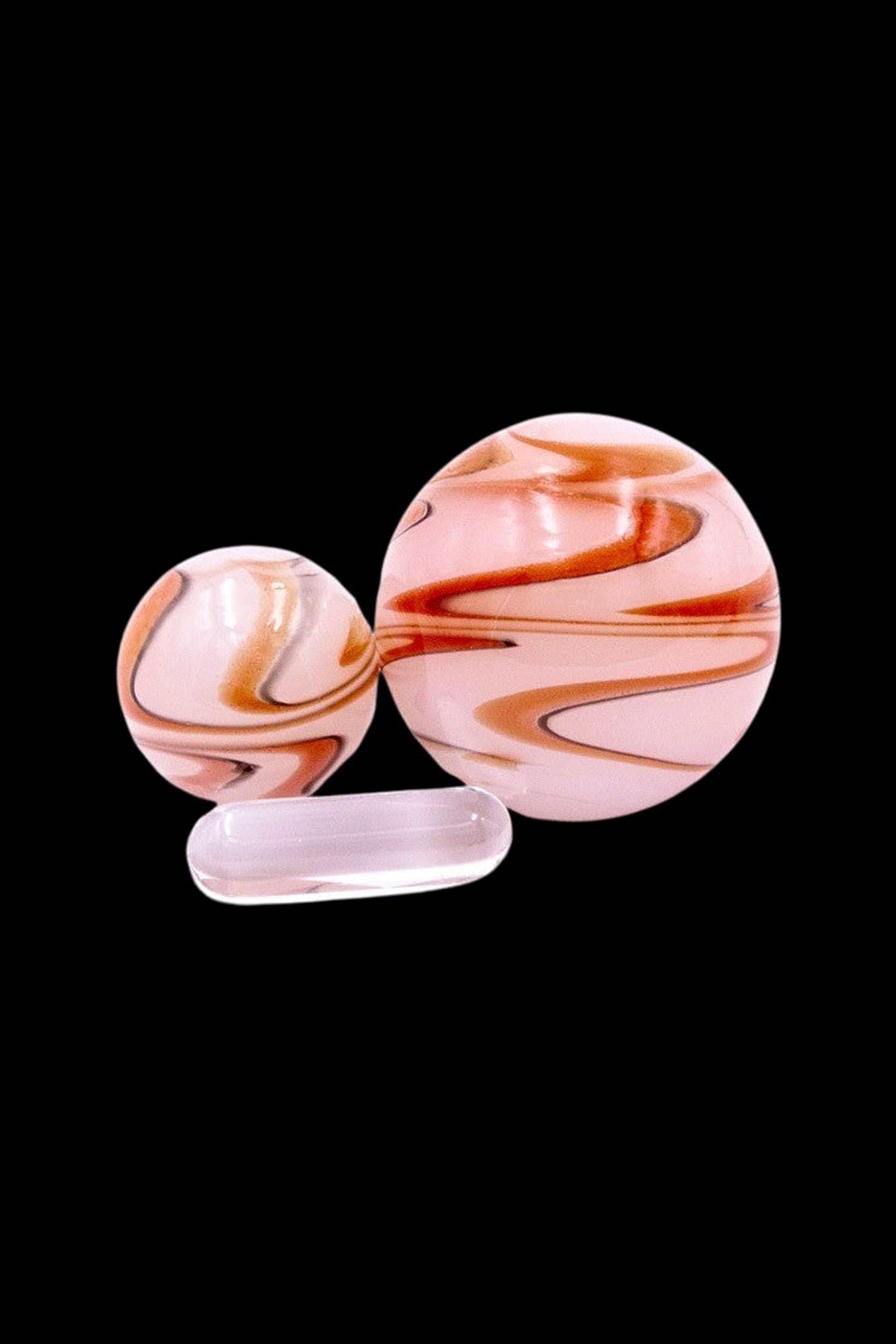 Swirled glass cannabis water pipe components on a black background.