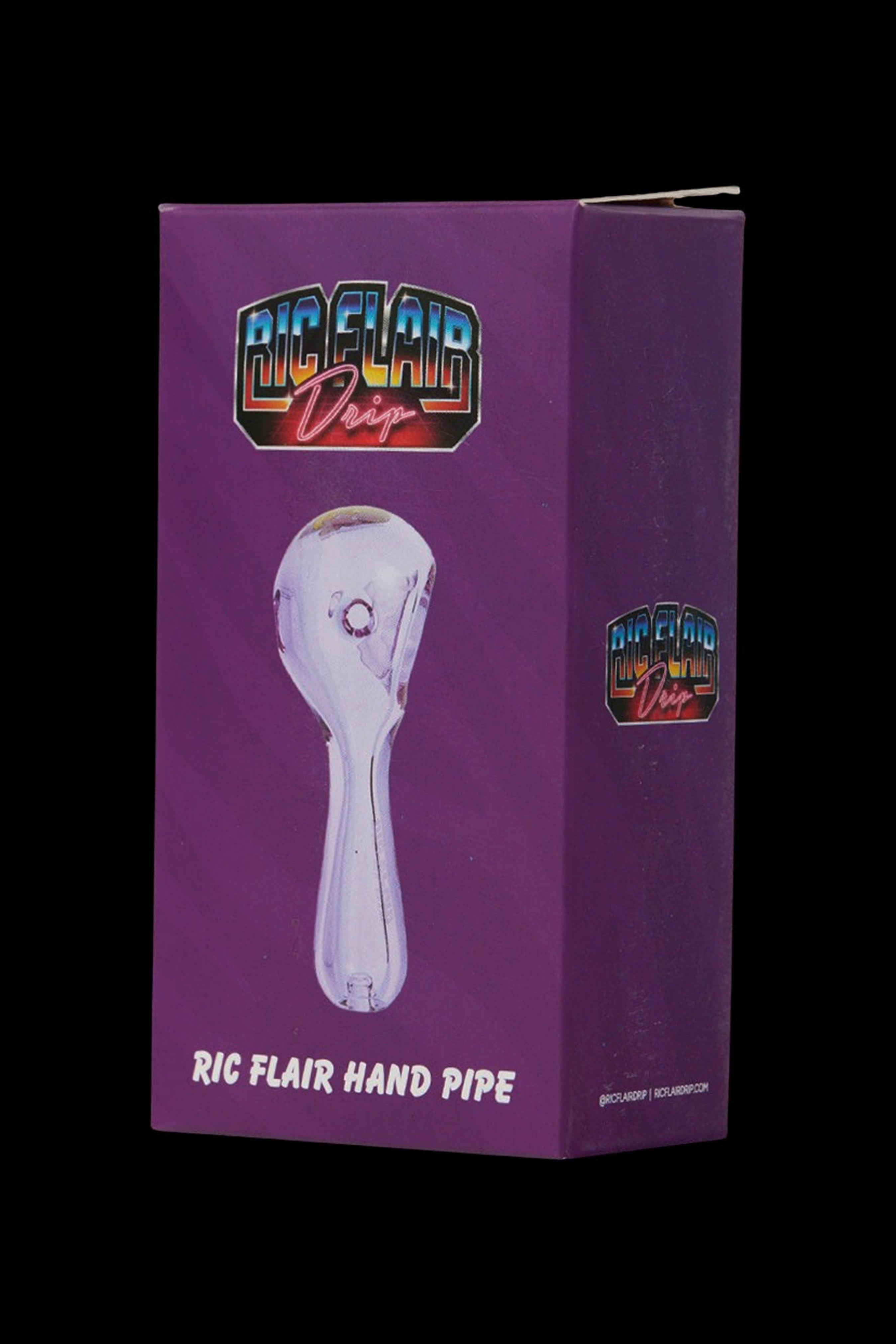 Pink glass hand pipe with “Ric Flair Drip” branding in a white box. <start_of_image>