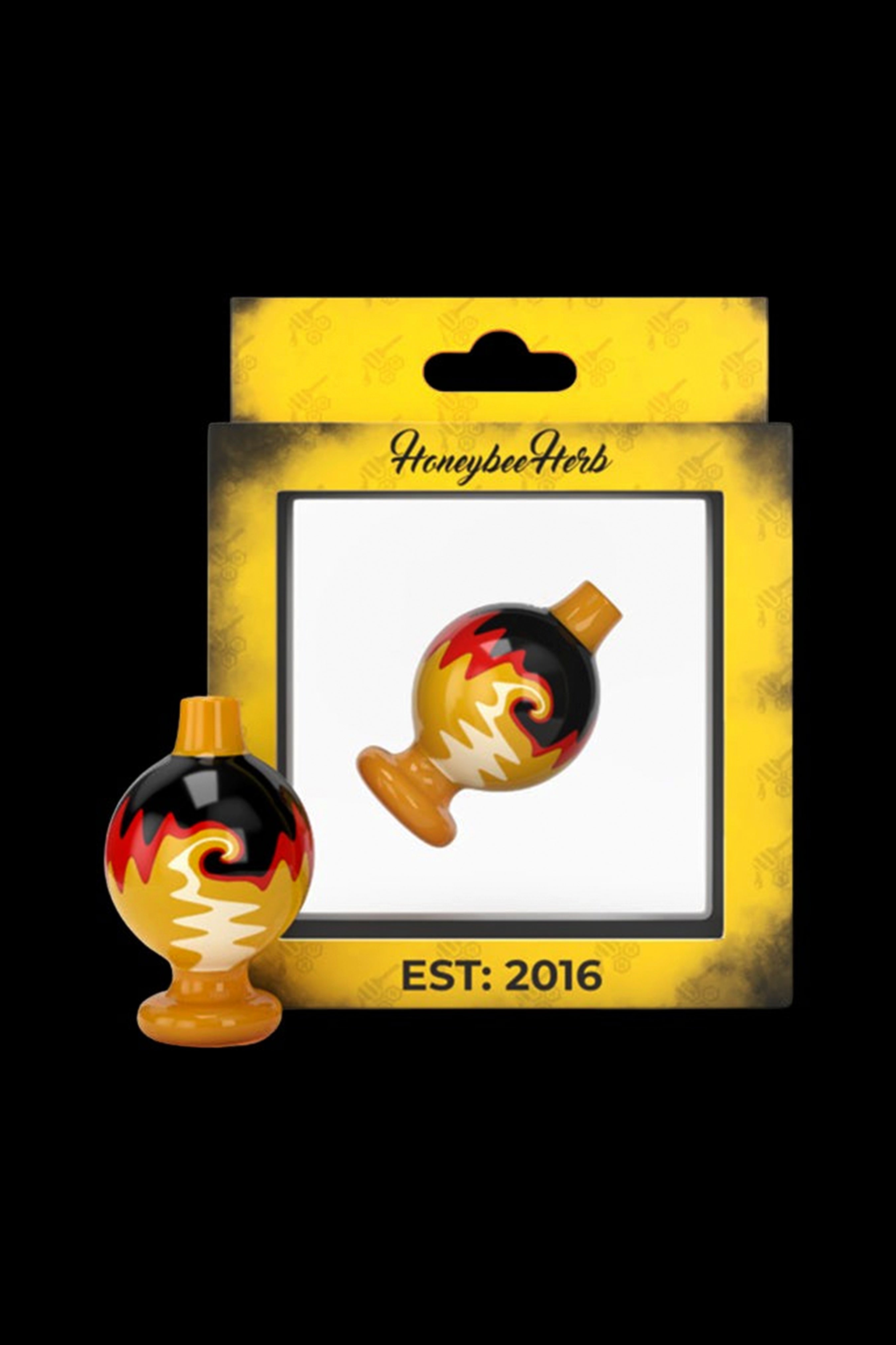 A promotional graphic featuring two ornate glass cannabis water pipes resembling Christmas ornaments, packaged on a textured yellow card labeled "Honeybee Herbs EST: 2016".