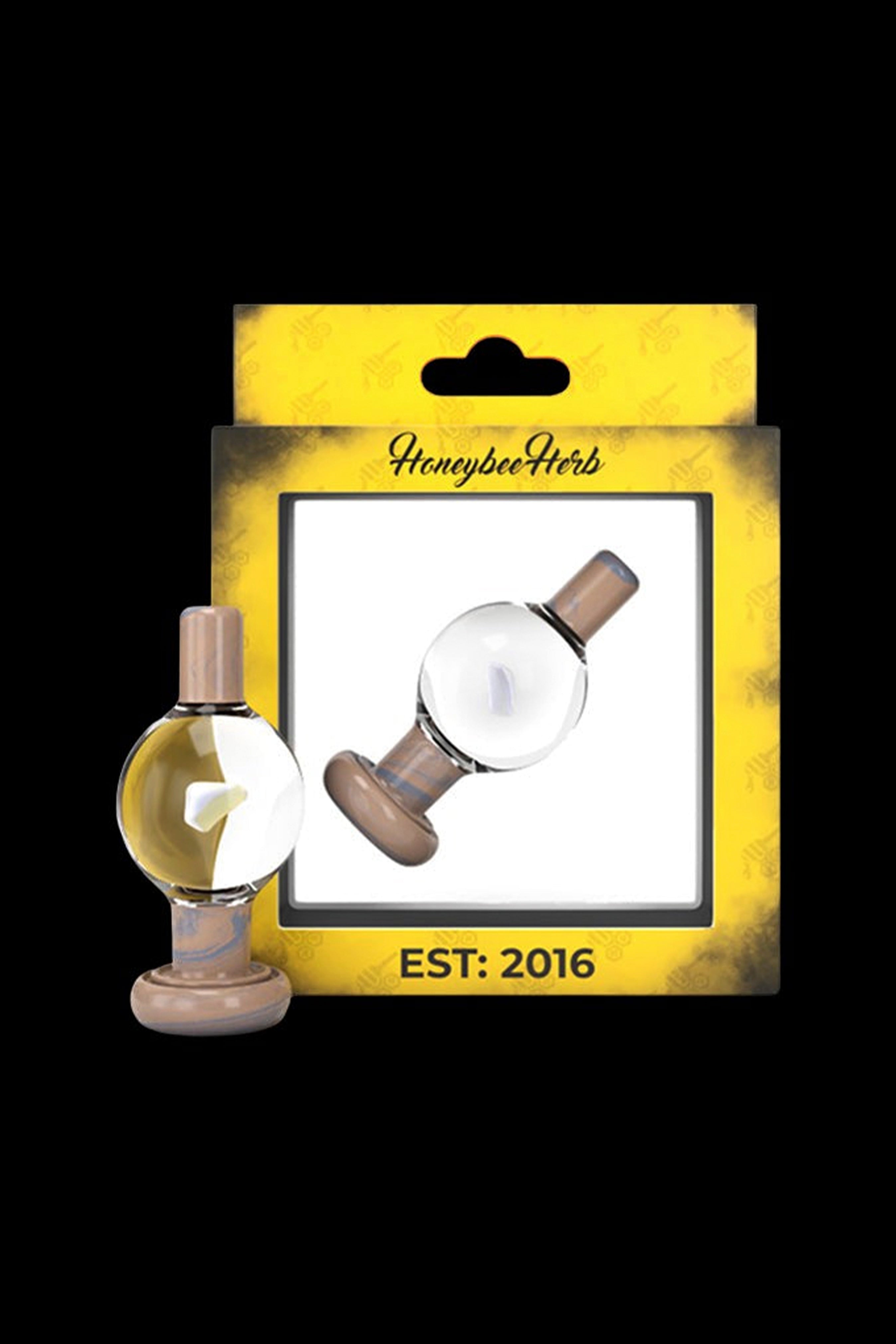 Glass oil dab rig with packaging displaying “Honeybee Herb” and “Est. 2016”.