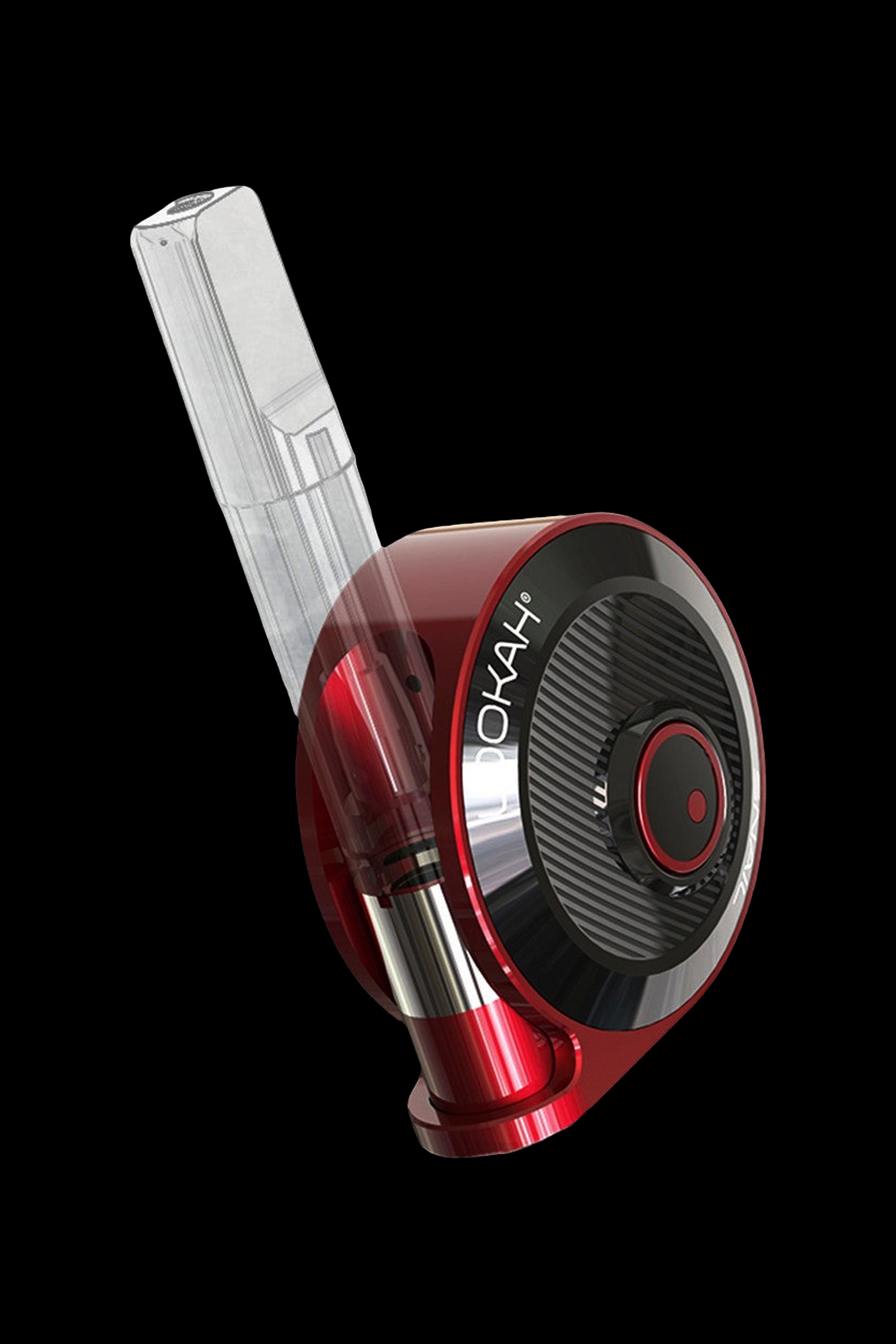 Red and clear cannabis vaporizer with the brand name “YOKAH” visible on the device.