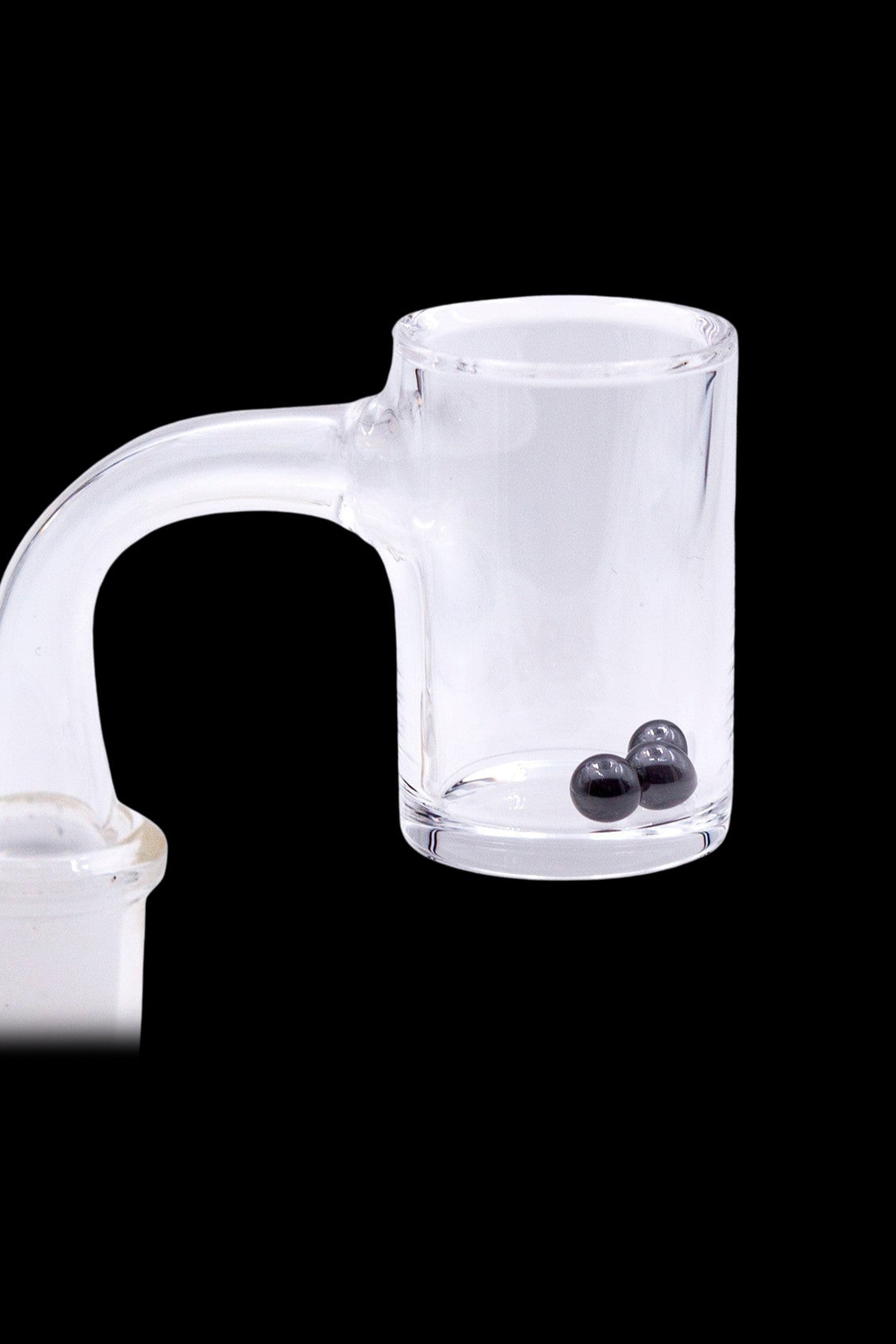 Clear glass dab rig with two black dab tool beads inside.