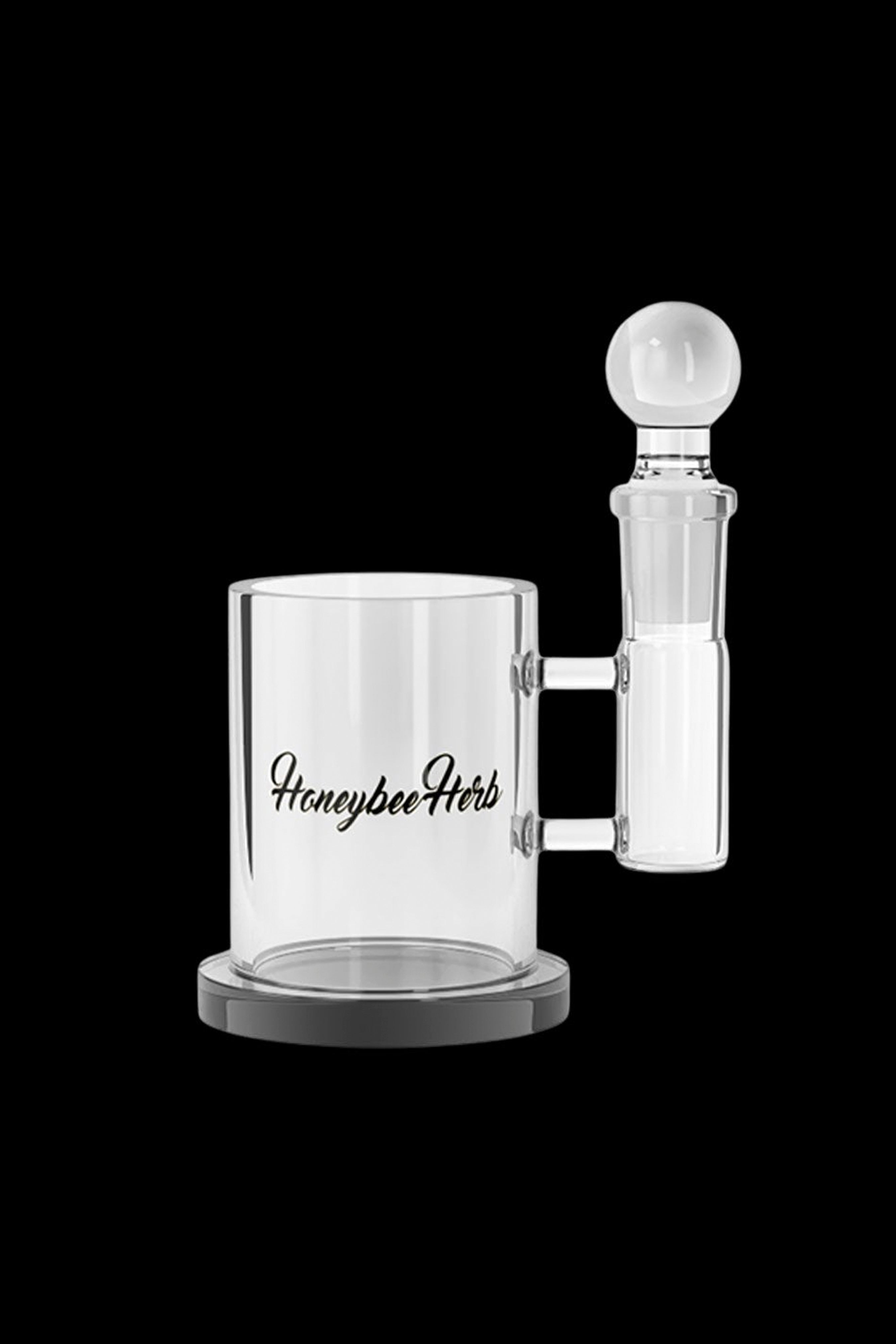 Clear glass water pipe with “Honeybee Herb” logo and spherical mouthpiece.