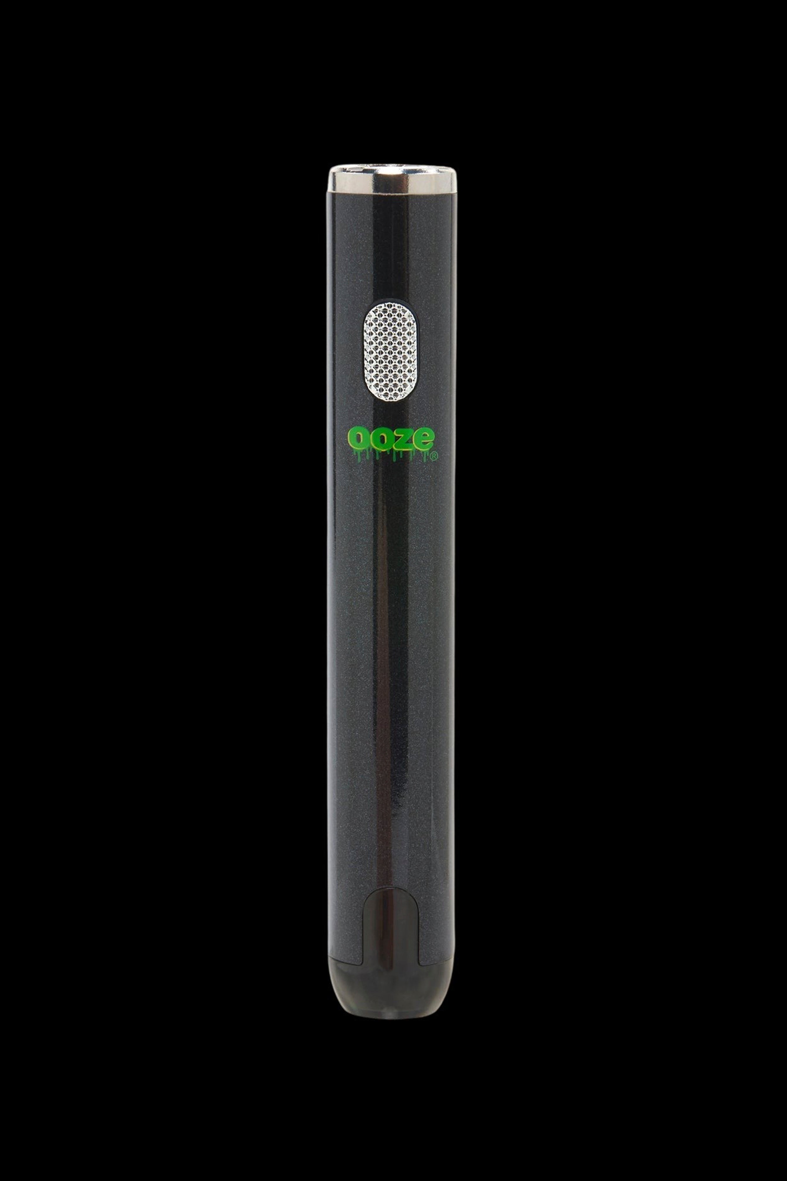 Black Ooze vape pen with green branding against a dark background.