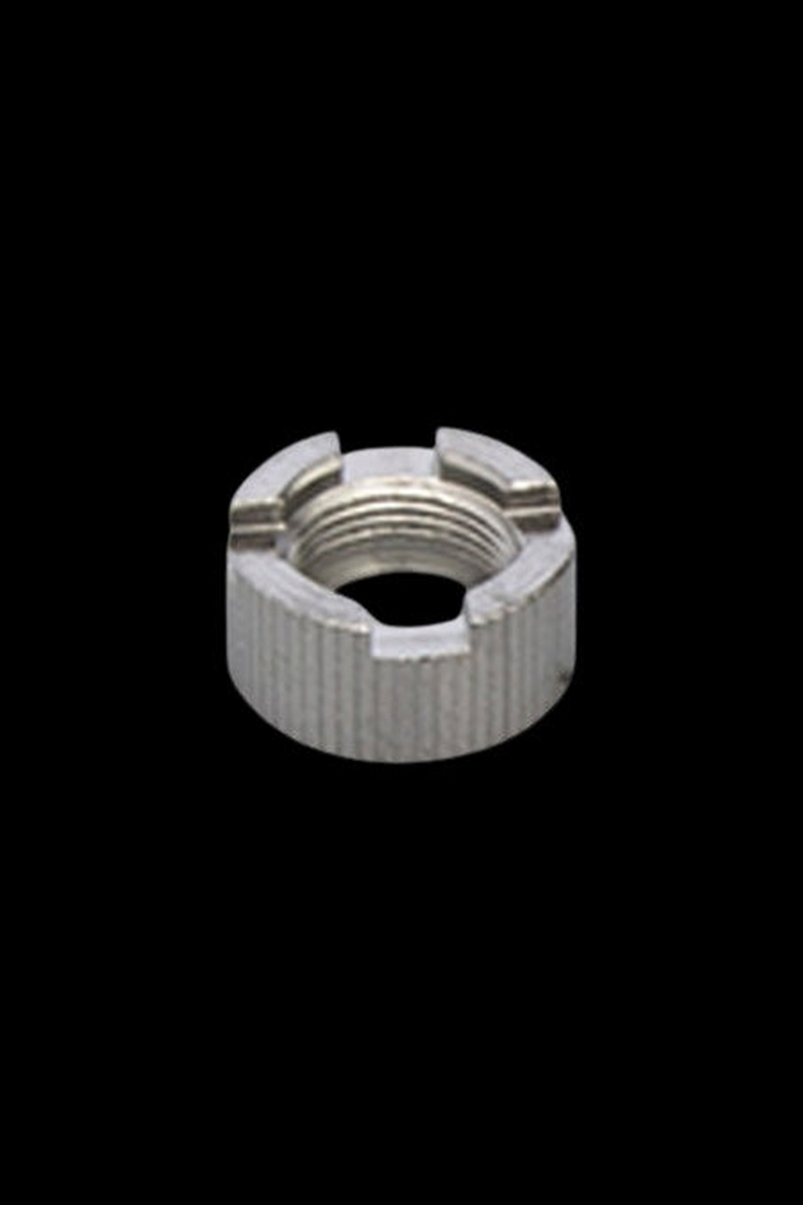 Silver cannabis oil cartridge threading cap isolated on black.