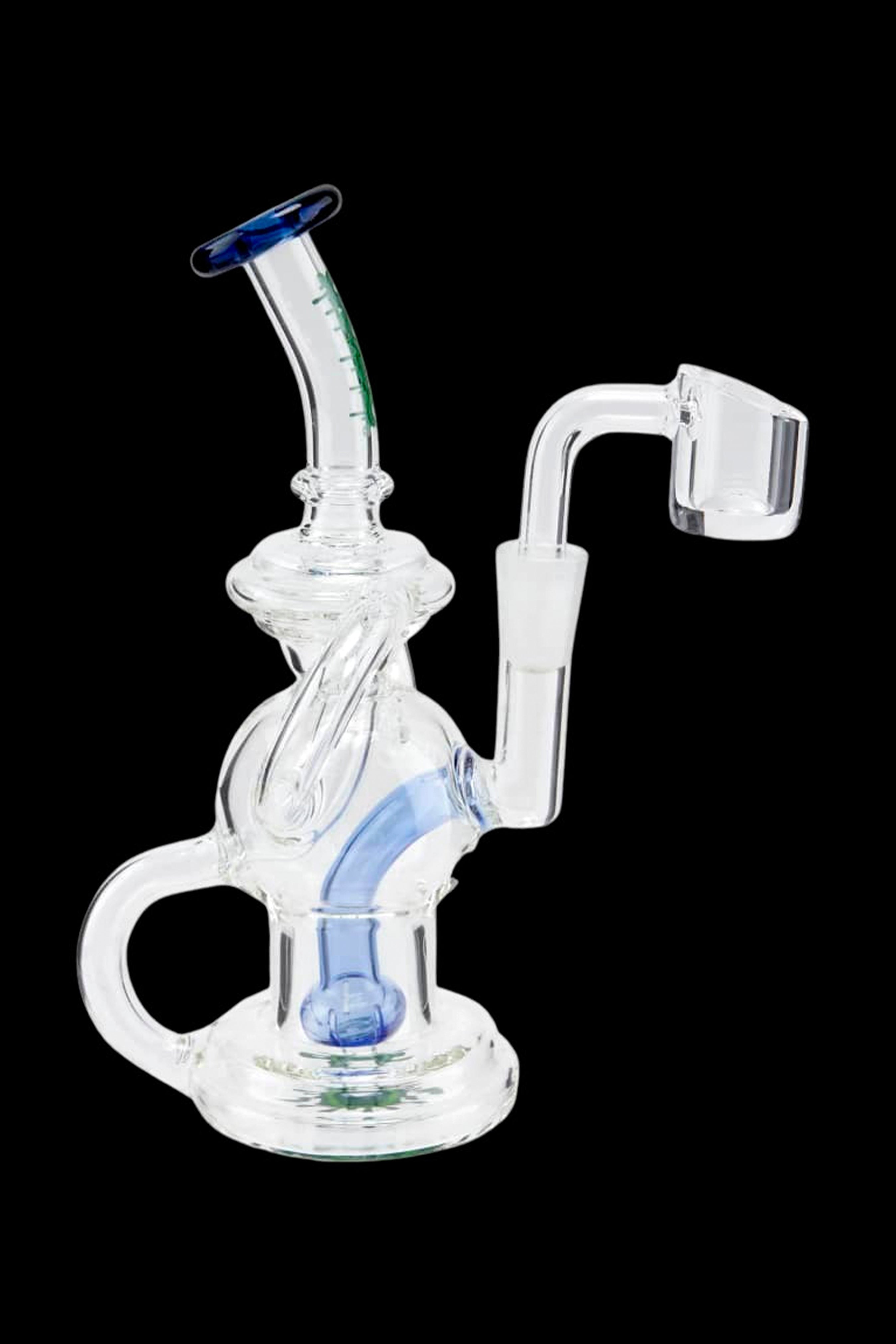 Clear glass dab rig with blue accents, featuring a bubbler base and quartz banger.