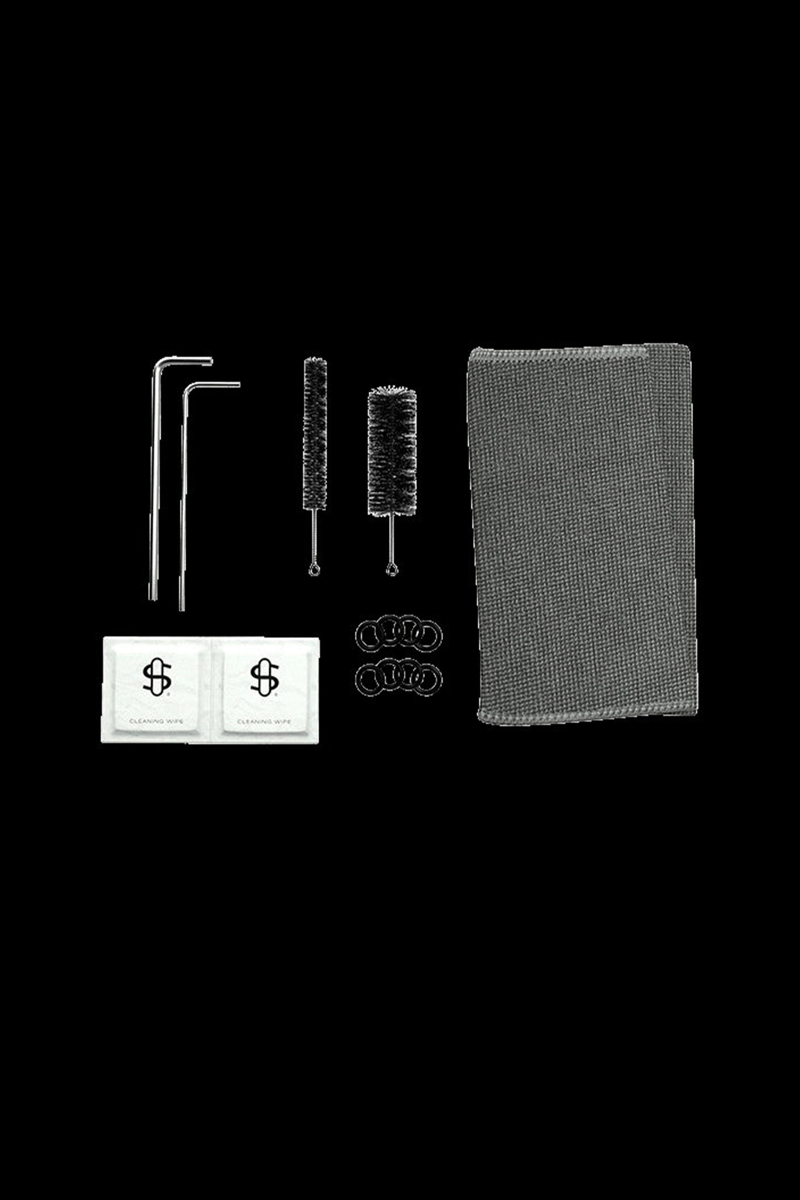 Cannabis accessory cleaning kit with brushes, pipe cleaners, and wipes on a dark background.