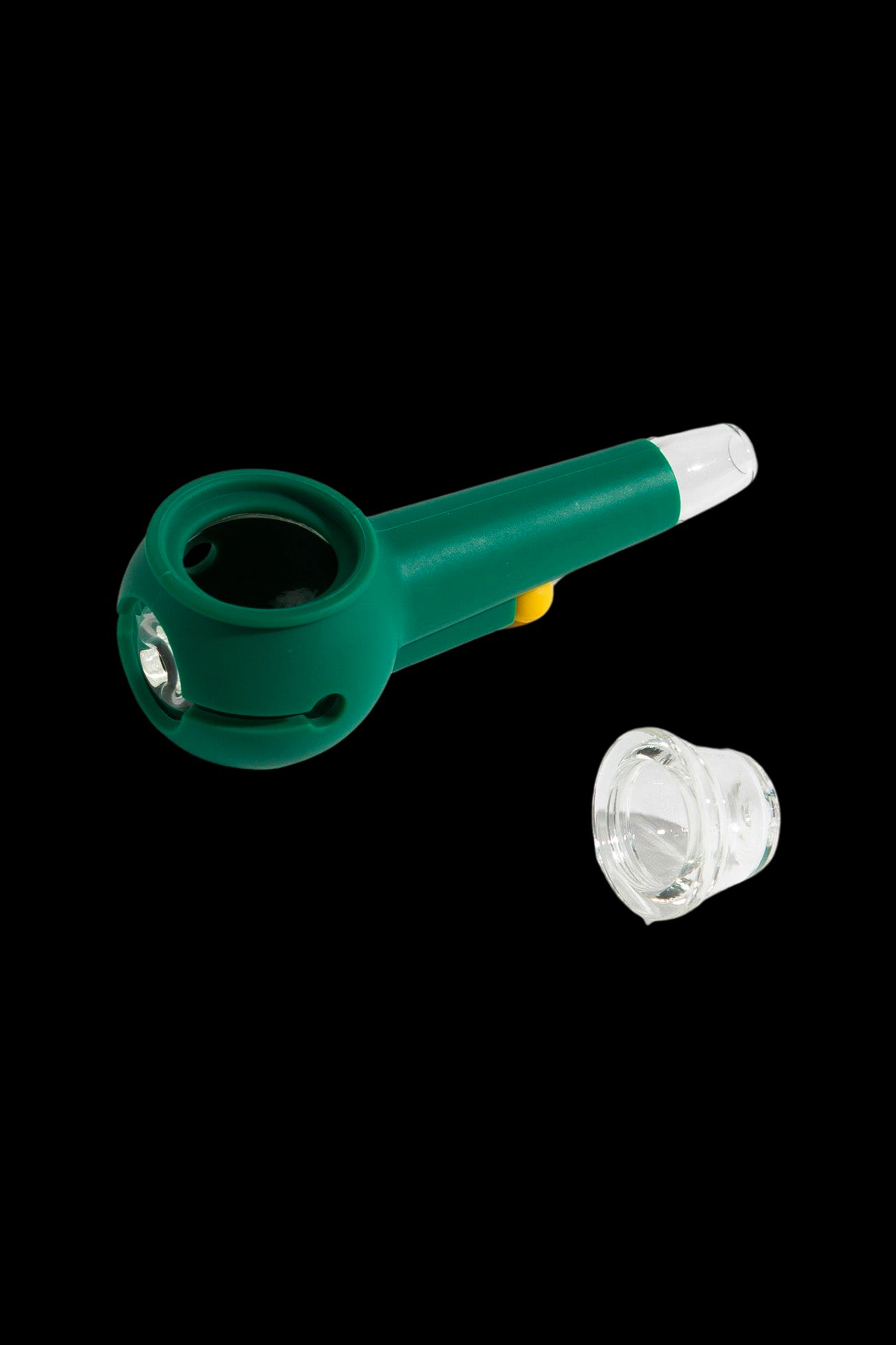 Emerald green silicone pipe with a glass bowl, isolated on a black background.