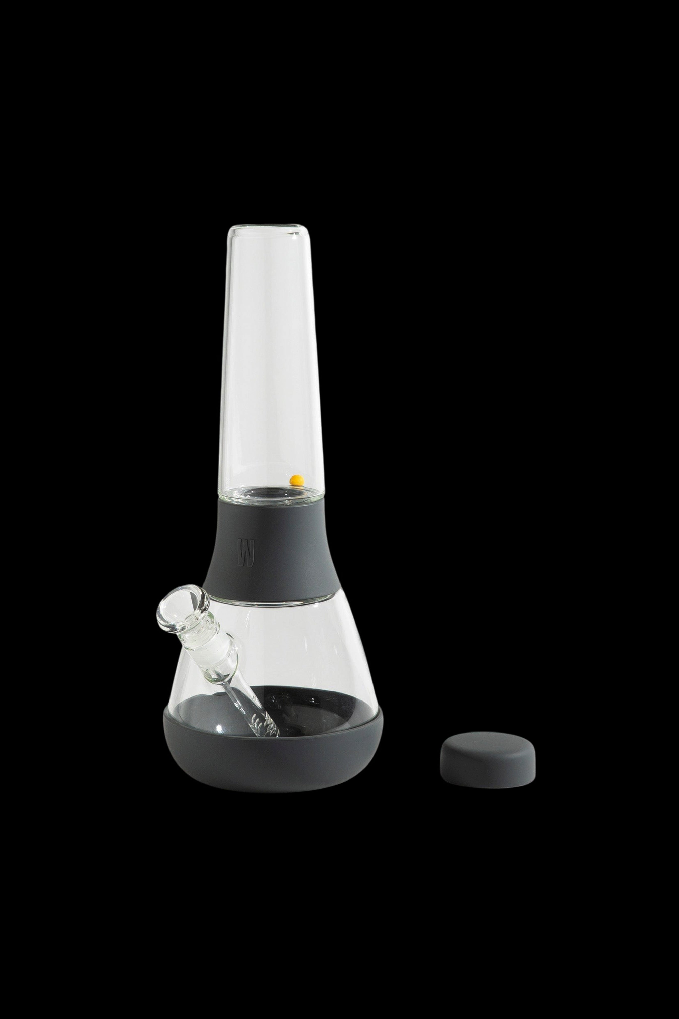 Black silicone bong with a glass chamber and downstem.