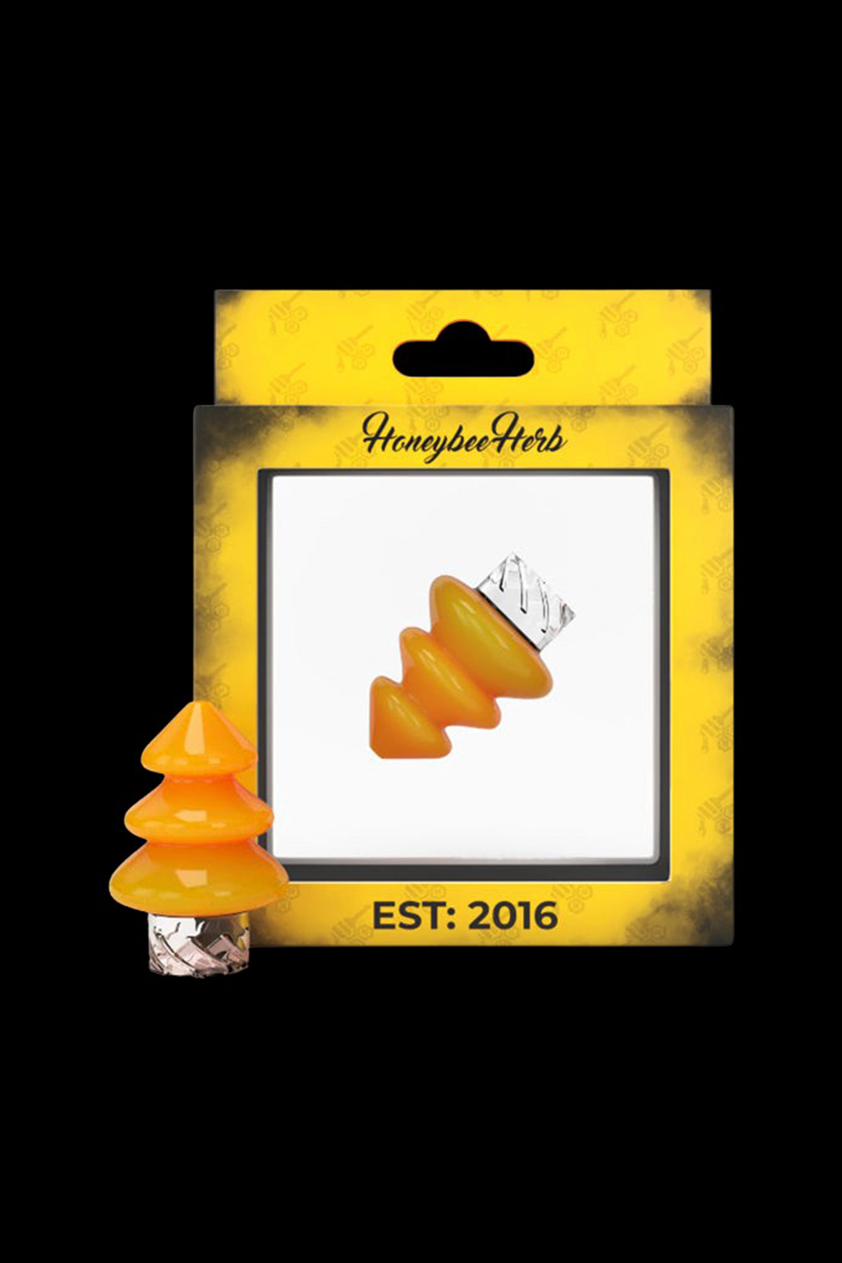 Honeybee Herb cannabis accessory packaging featuring a clear orange oil dome on a yellow card with "EST. 2016".