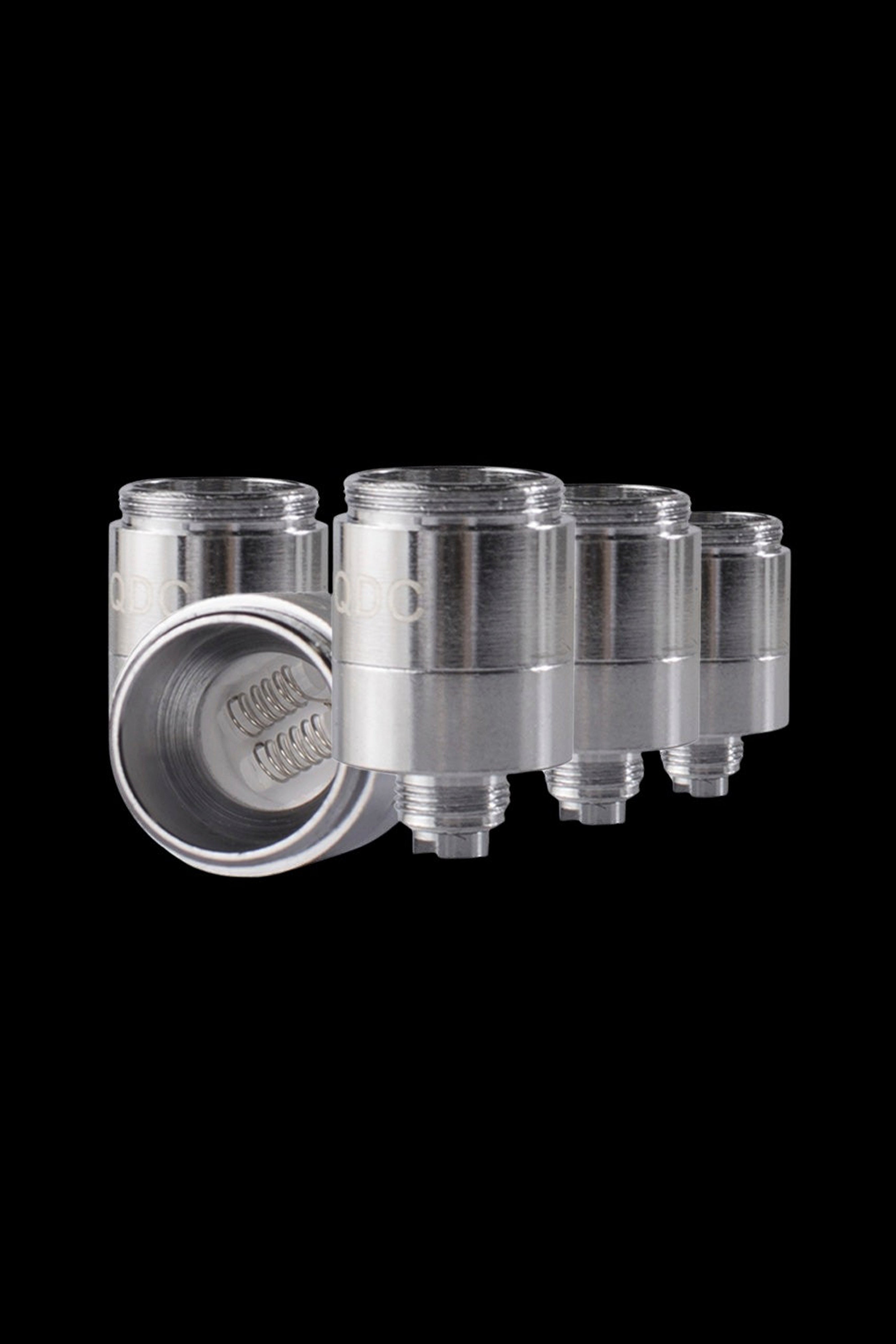 Silver cannabis oil cartridges arranged in a row on a black background.