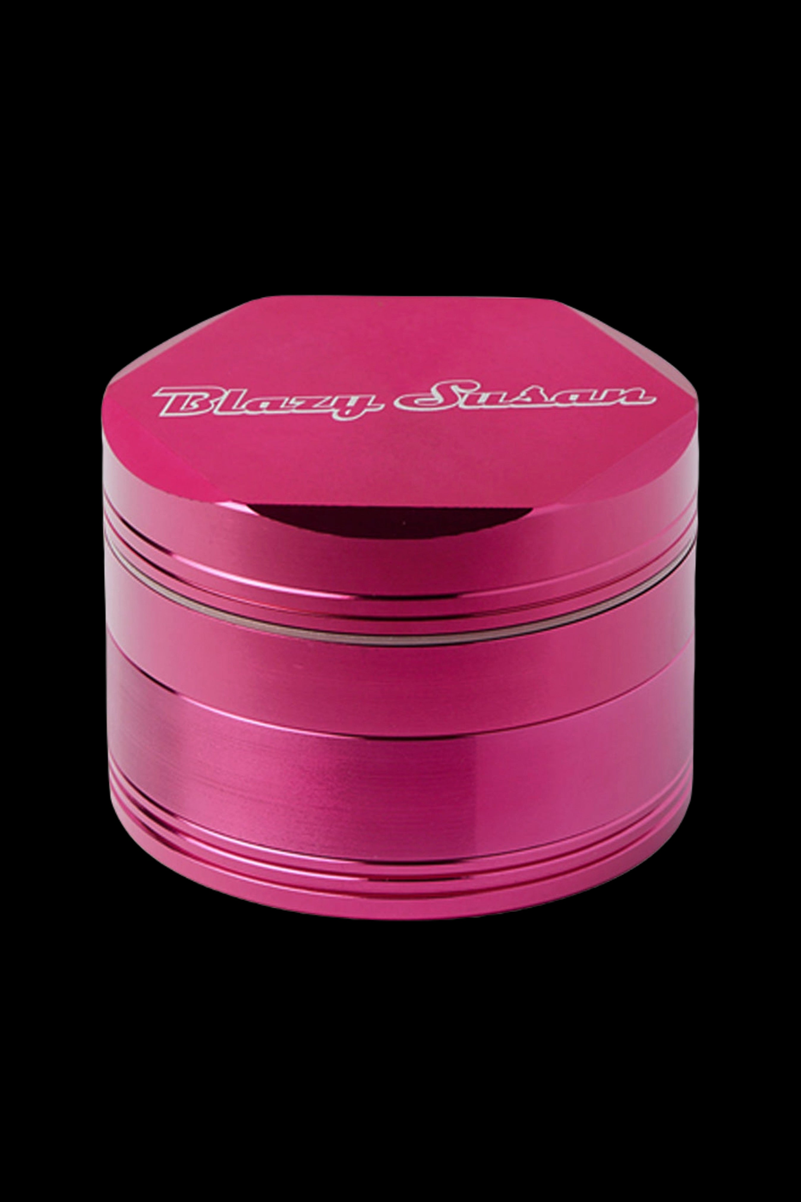 Pink four-piece metal grinder with “Blazy Susan” logo.
