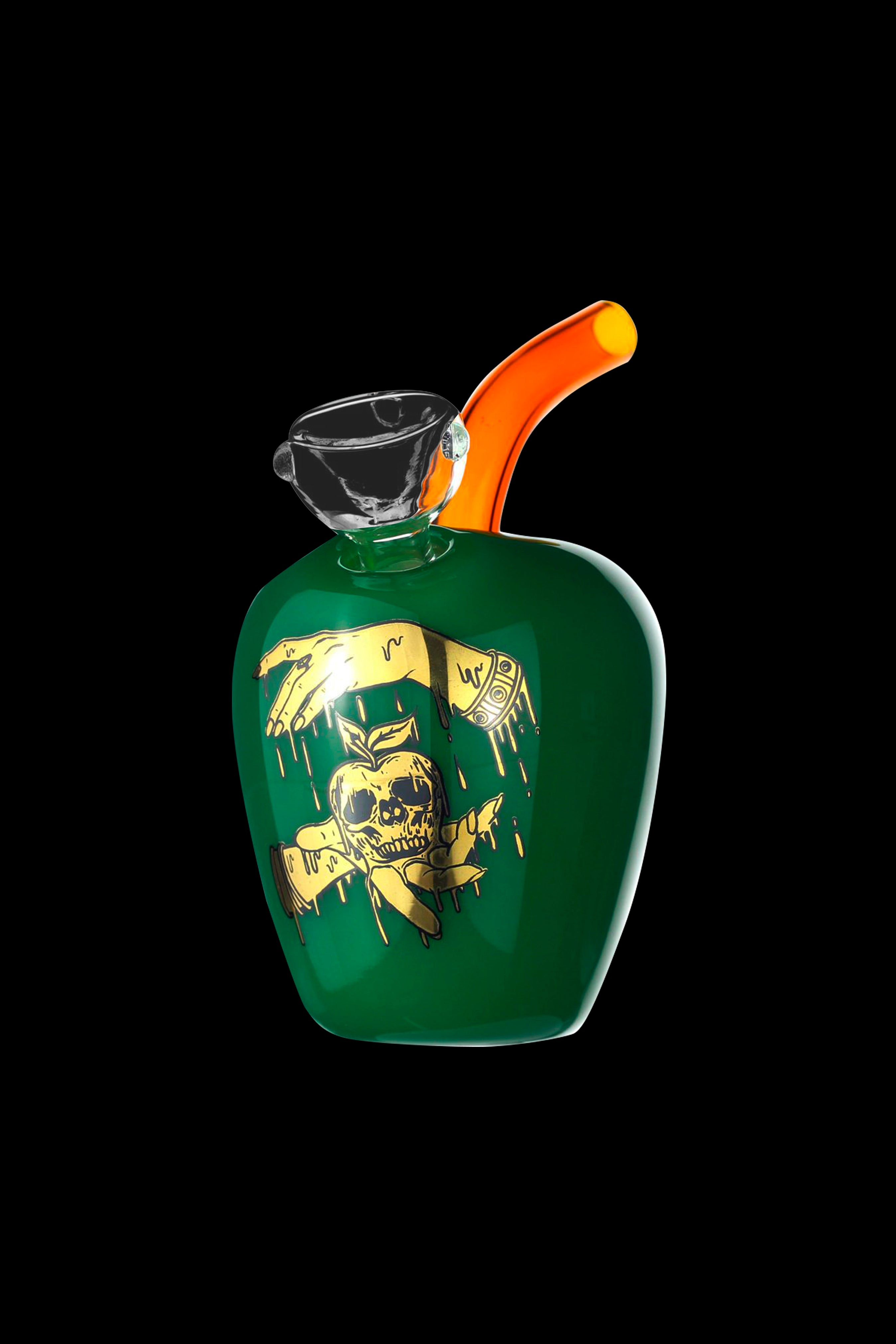 Green glass apple-shaped water pipe with gold skull and cannabis leaf decals, studio shot.