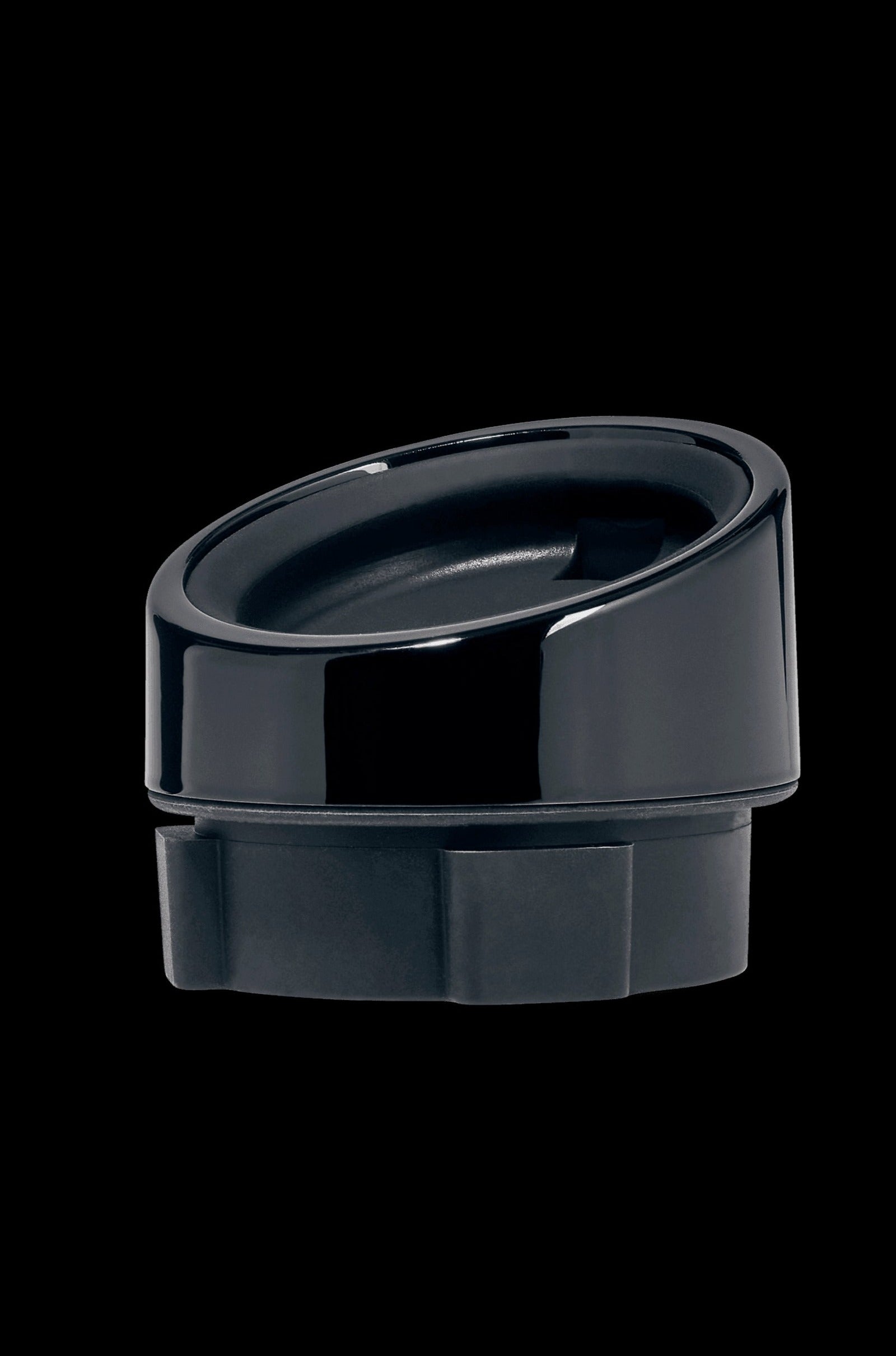 Black cannabis oil cartridge cap isolated on a black background.