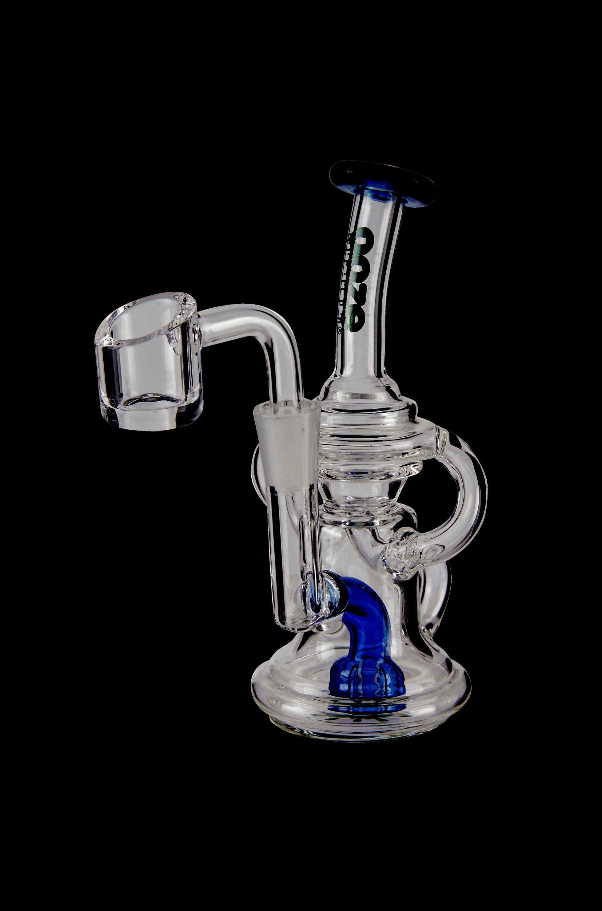 Clear glass dab rig with blue accents and a quartz banger.