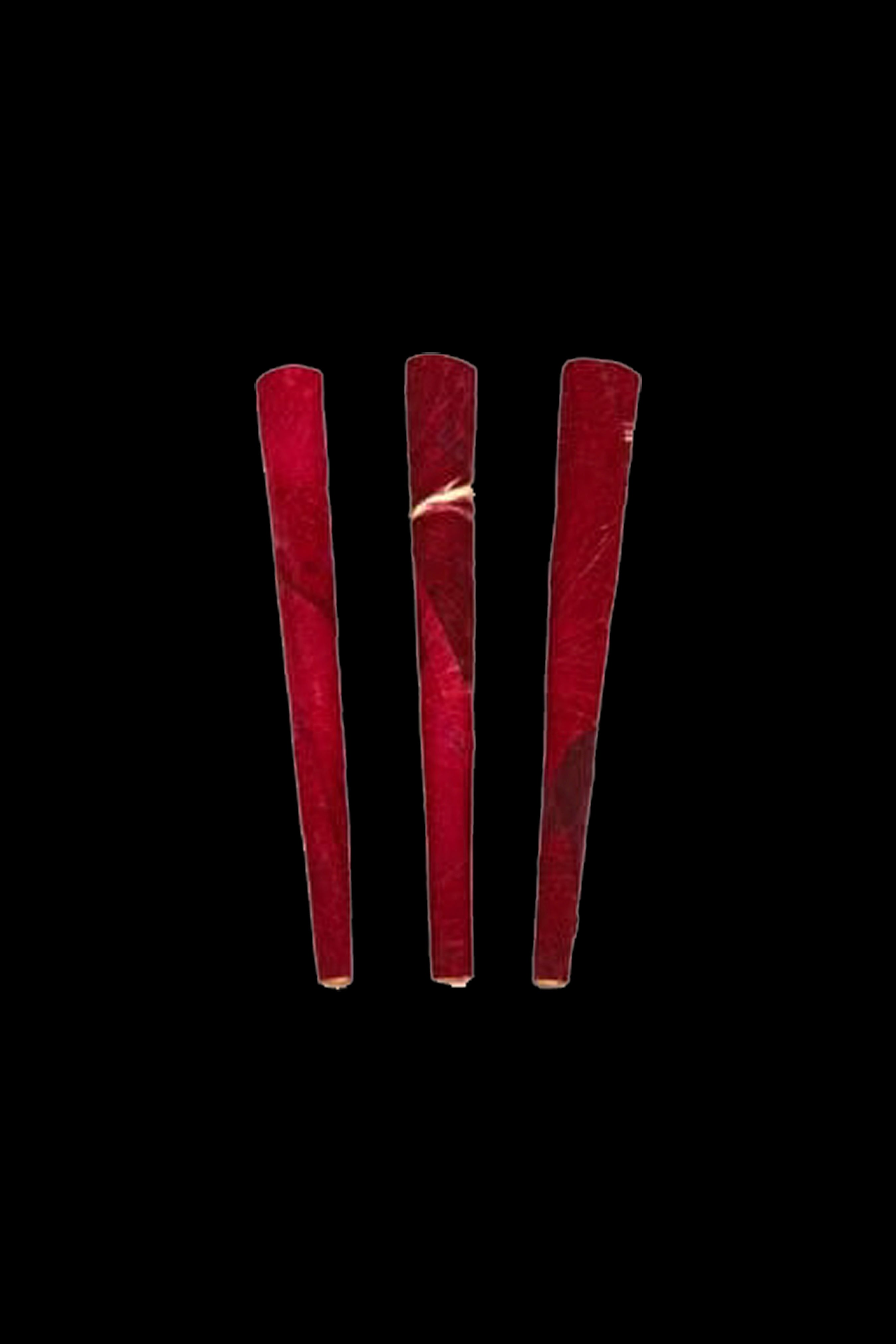 Red pre-rolled cone filters against a black background.