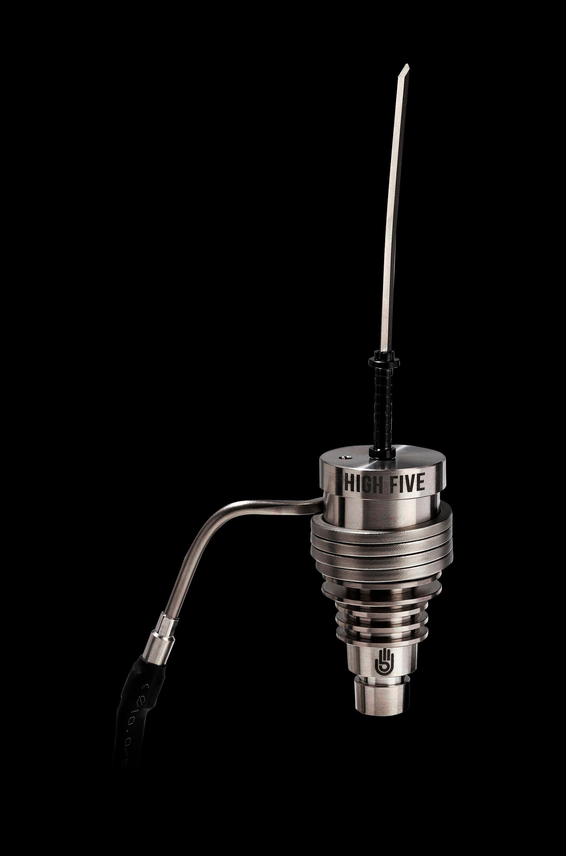 Silver cannabis dab rig with glass carb cap and coil.