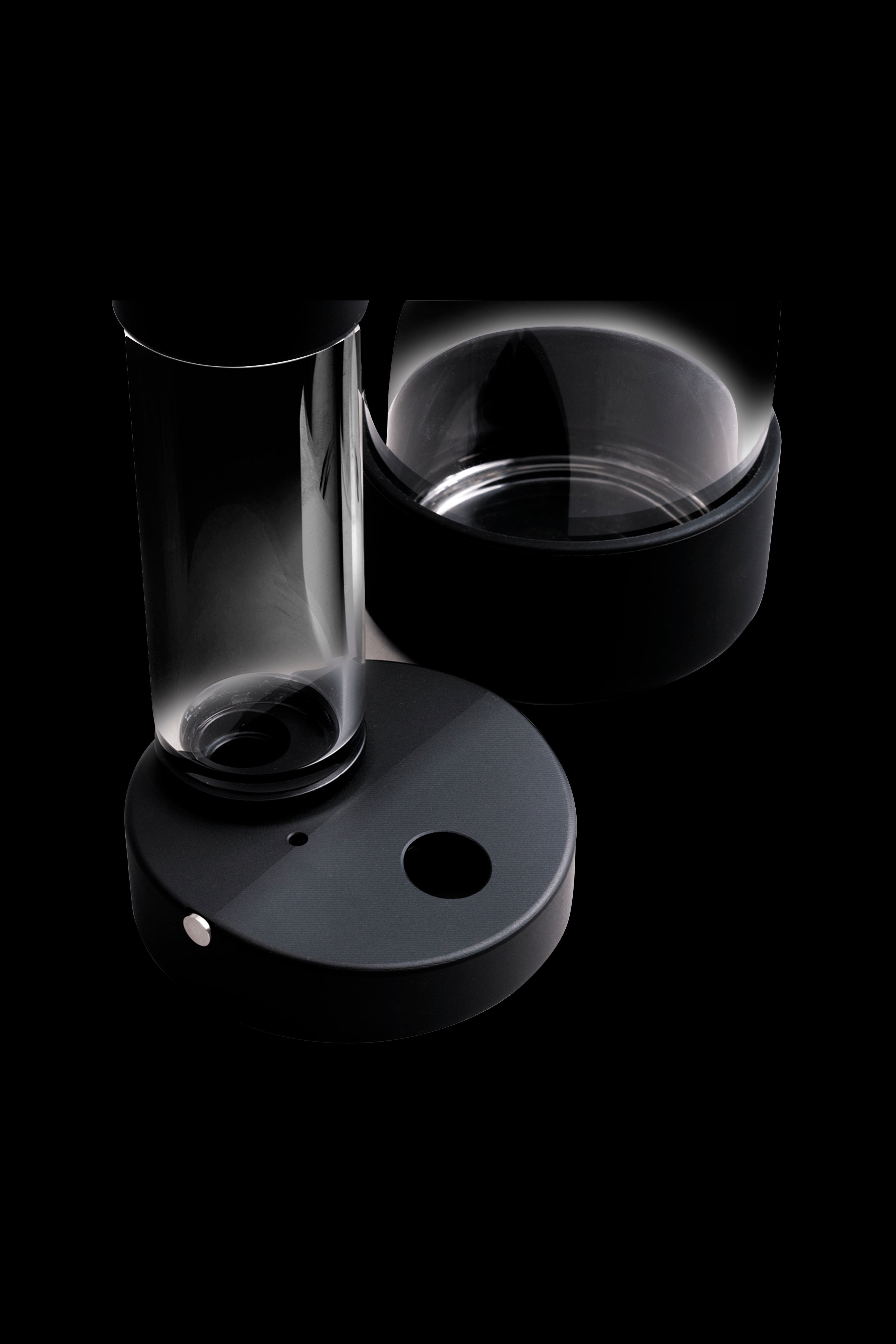 Sleek black cannabis oil rig with a glass bubbler.