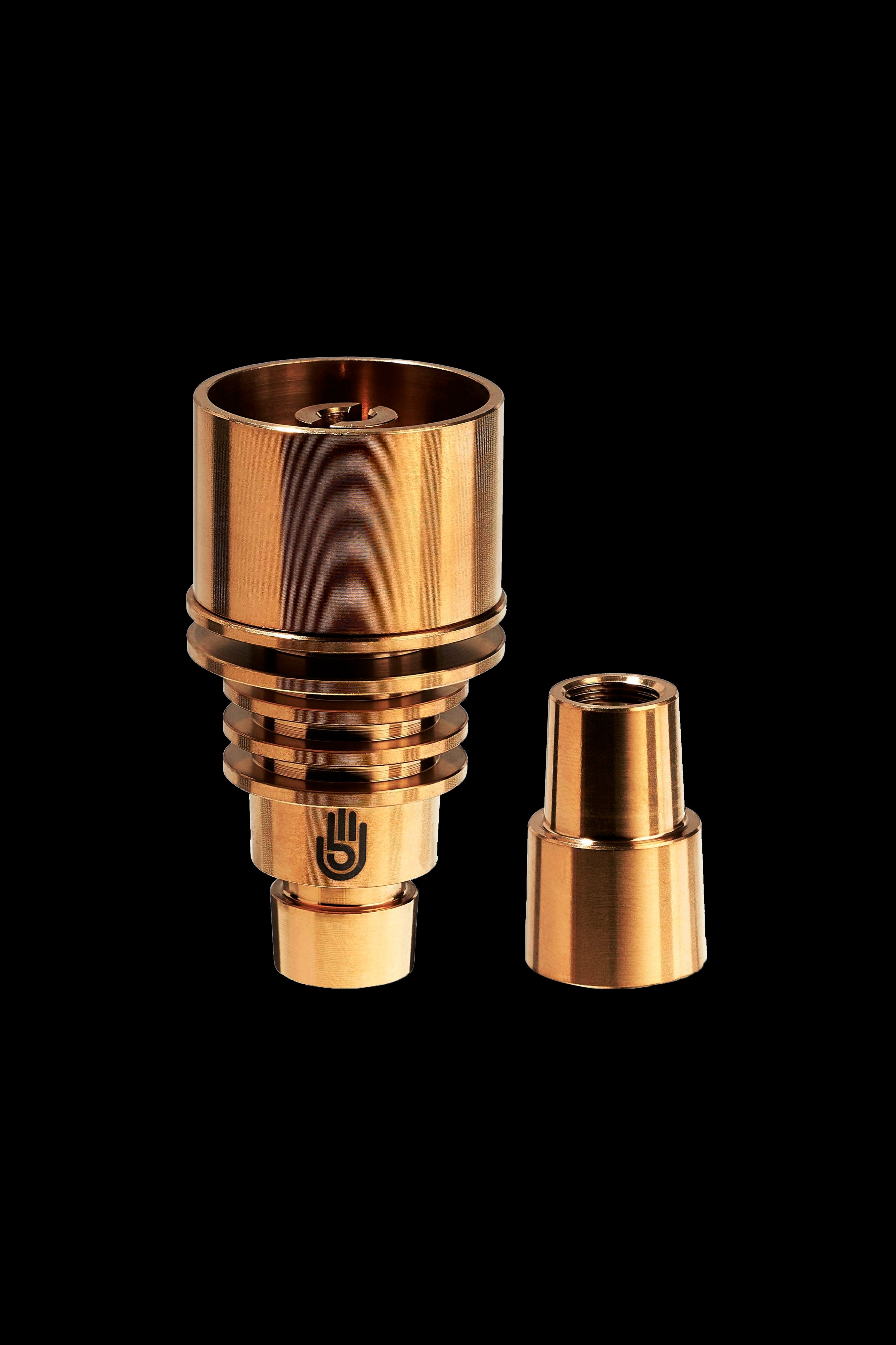 Bronze cannabis oil rig concentrate nail and carb cap set on a black background.