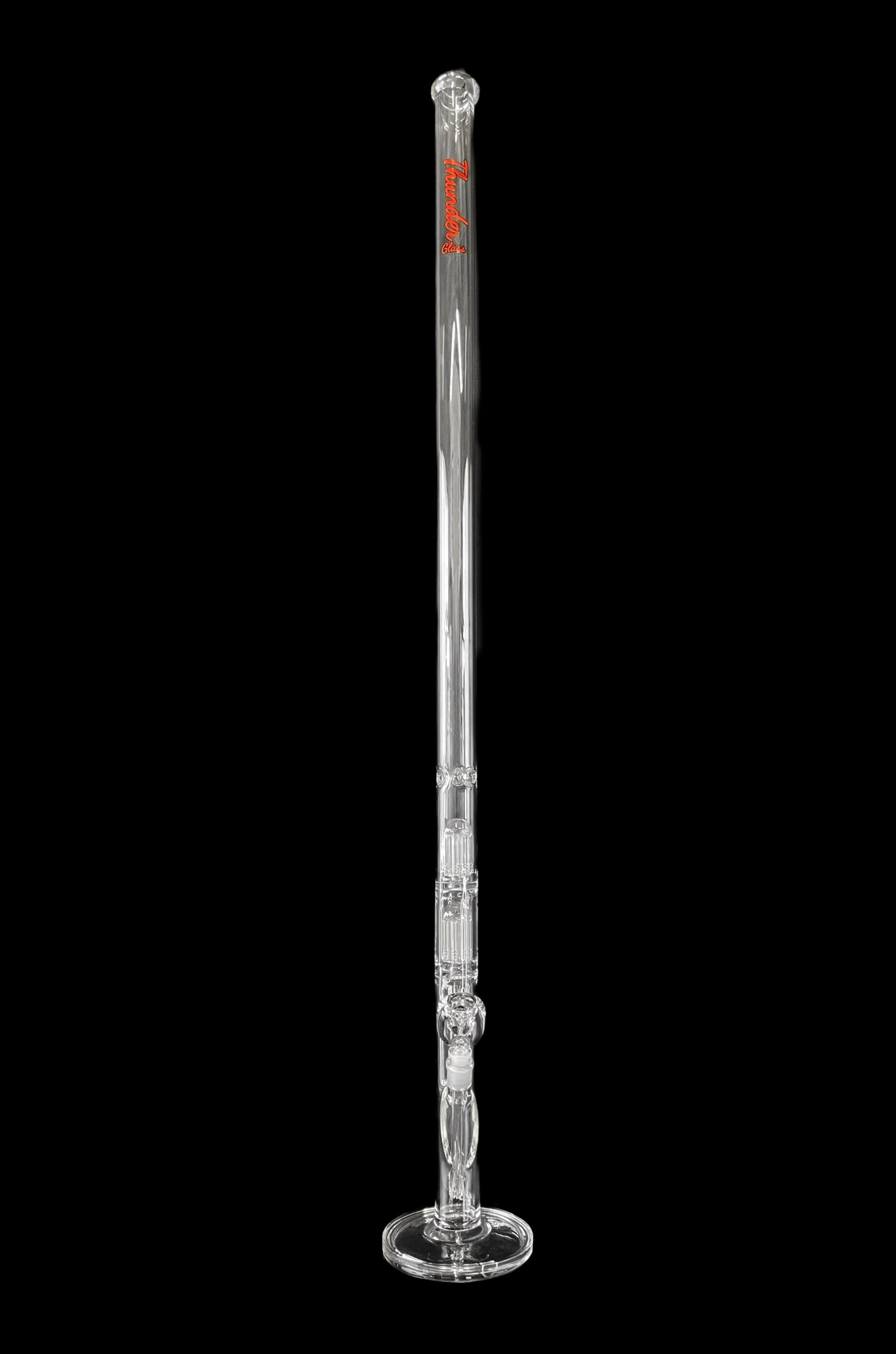 Clear glass bong with percolators, isolated on black.