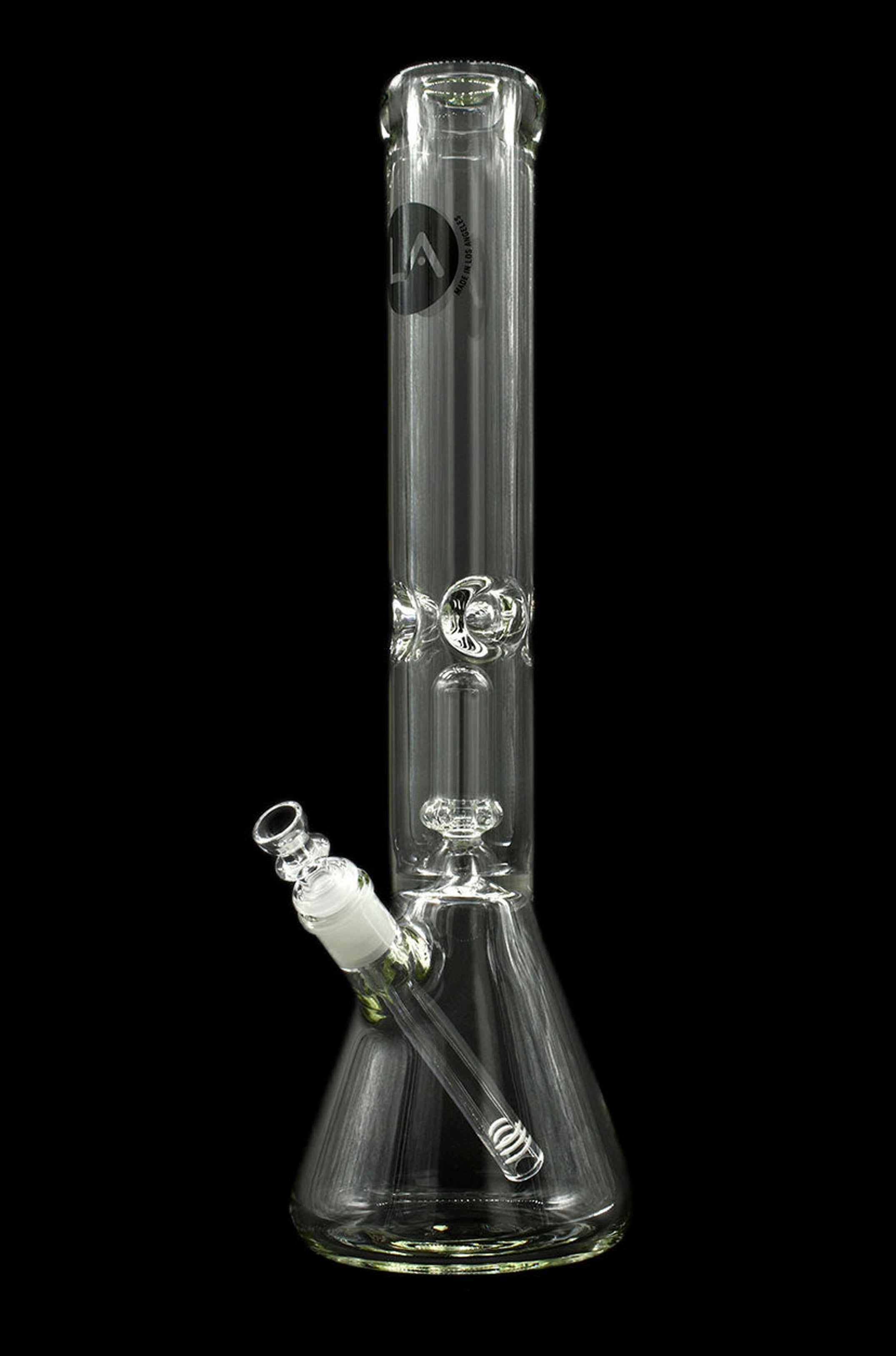 Clear glass bong with intricate detailing and a green accent, isolated on a black background.
