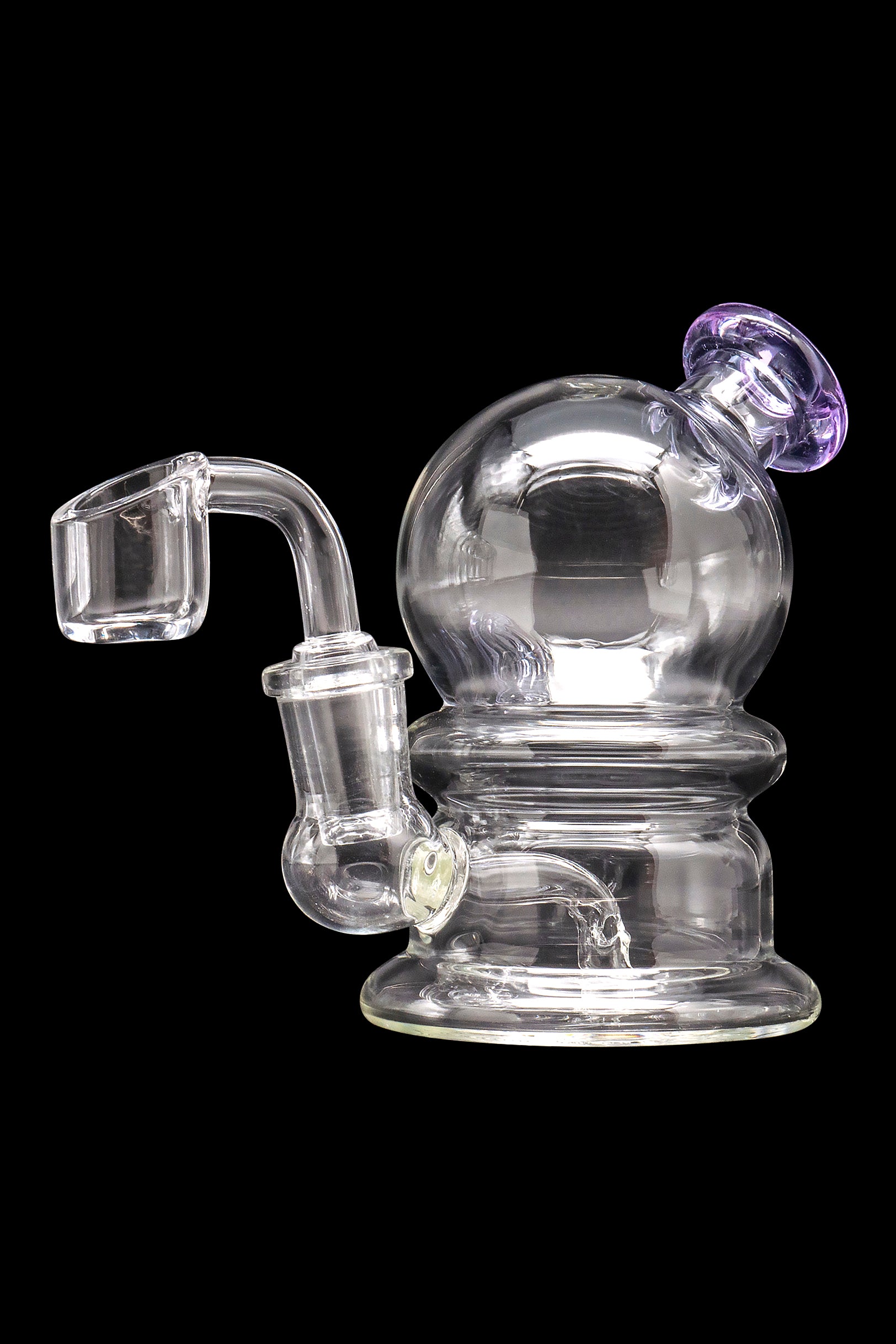 Clear glass dab rig with a quartz banger and purple accent.