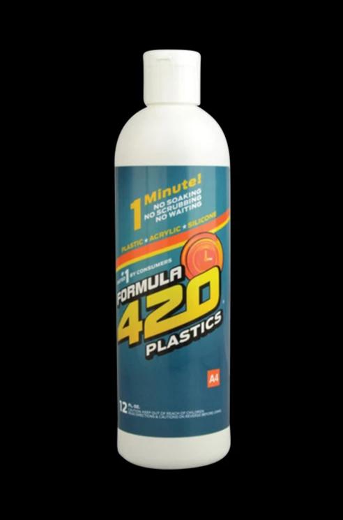 Front-lit, centered bottle shot of Formula 420 Plastics Cleaner - 12oz against a solid black background, showing its blue label and white cap.