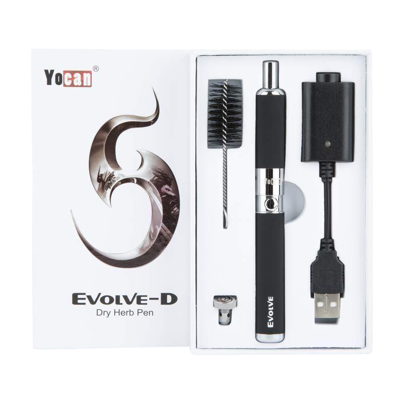Top-down view of the boxed Yocan Evolve-D Dry Herb Vaporizer Pen kit showing the black pen, brush, USB charger, and metal coil neatly fitted in white foam.