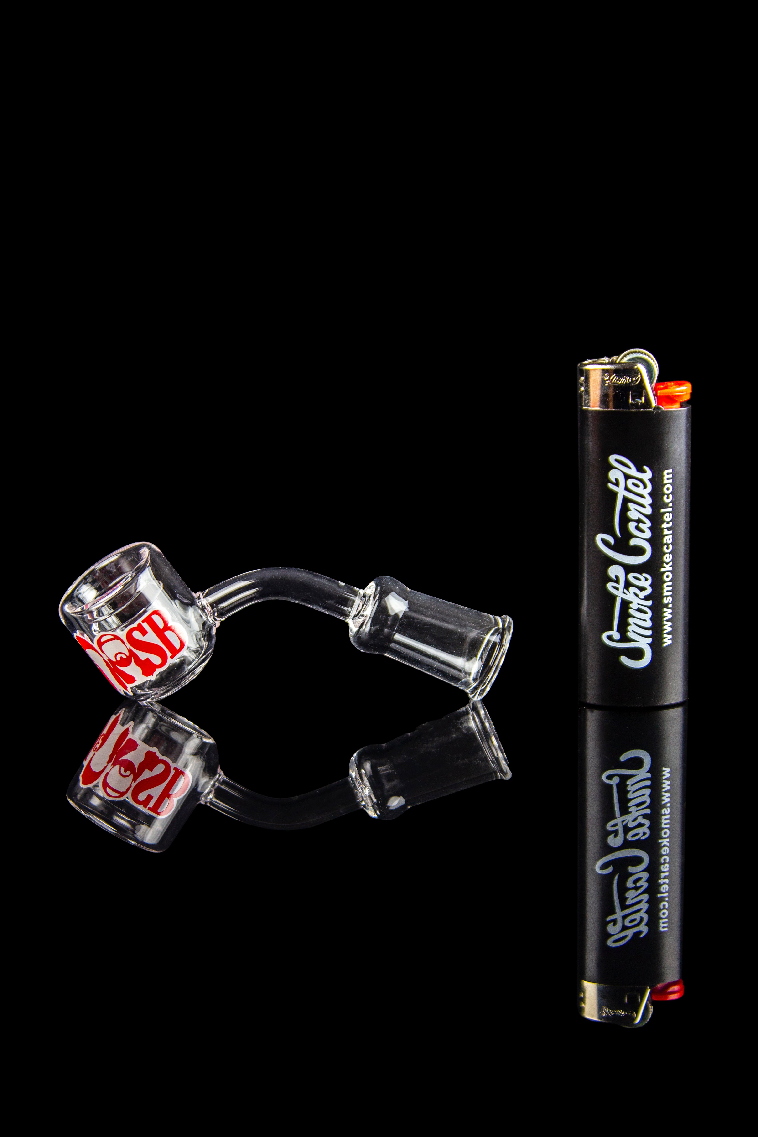 Glass cannabis pipes and lighter against a black background.