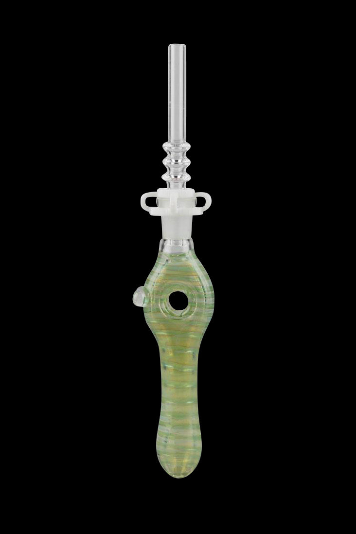 Green glass dab rig with a detailed design and spherical collection chamber.