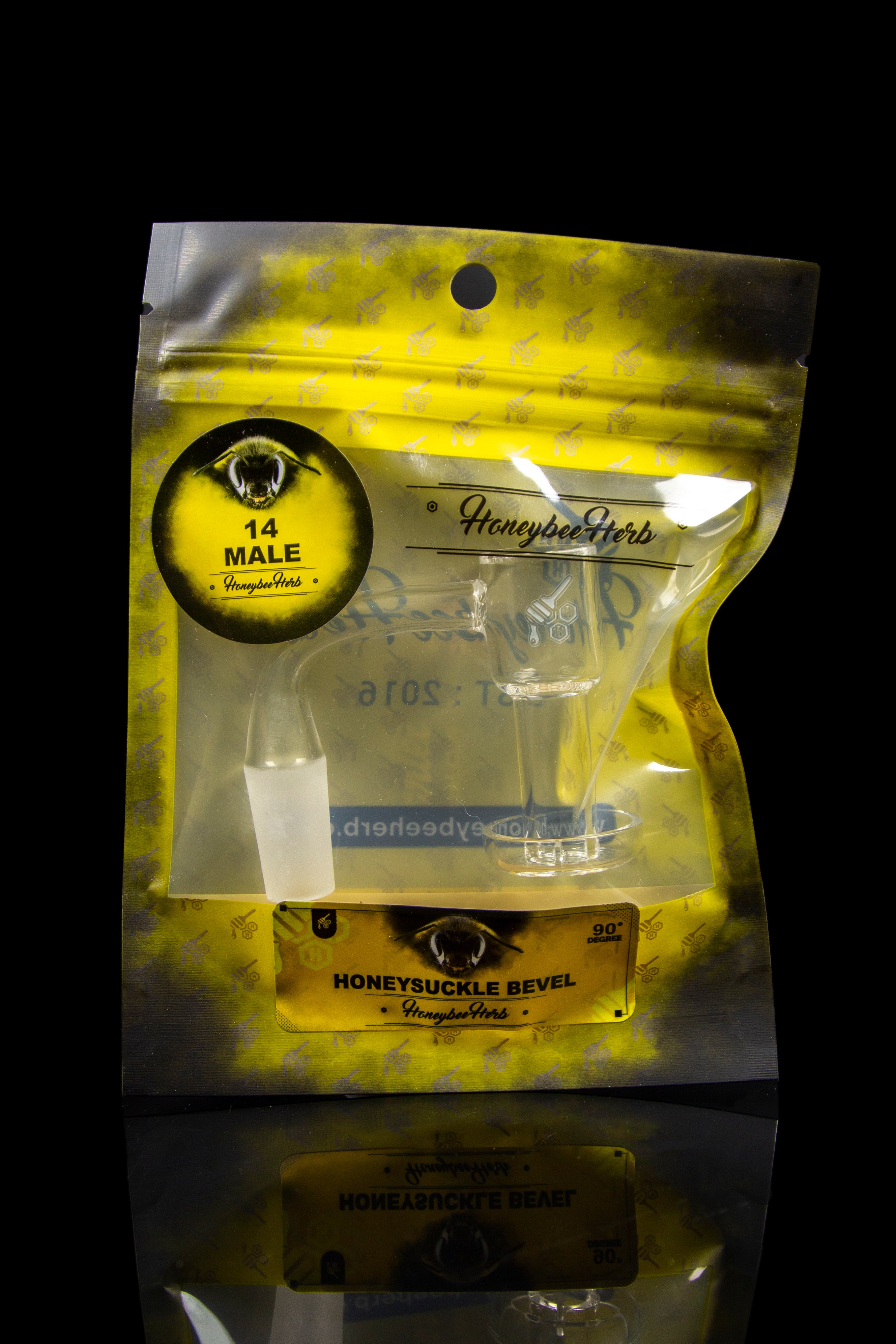 Sealed mylar bag of orange cannabis dab straws labeled “Honeysuckle Bevel” by Honeybee Herbs. <start_of_image>