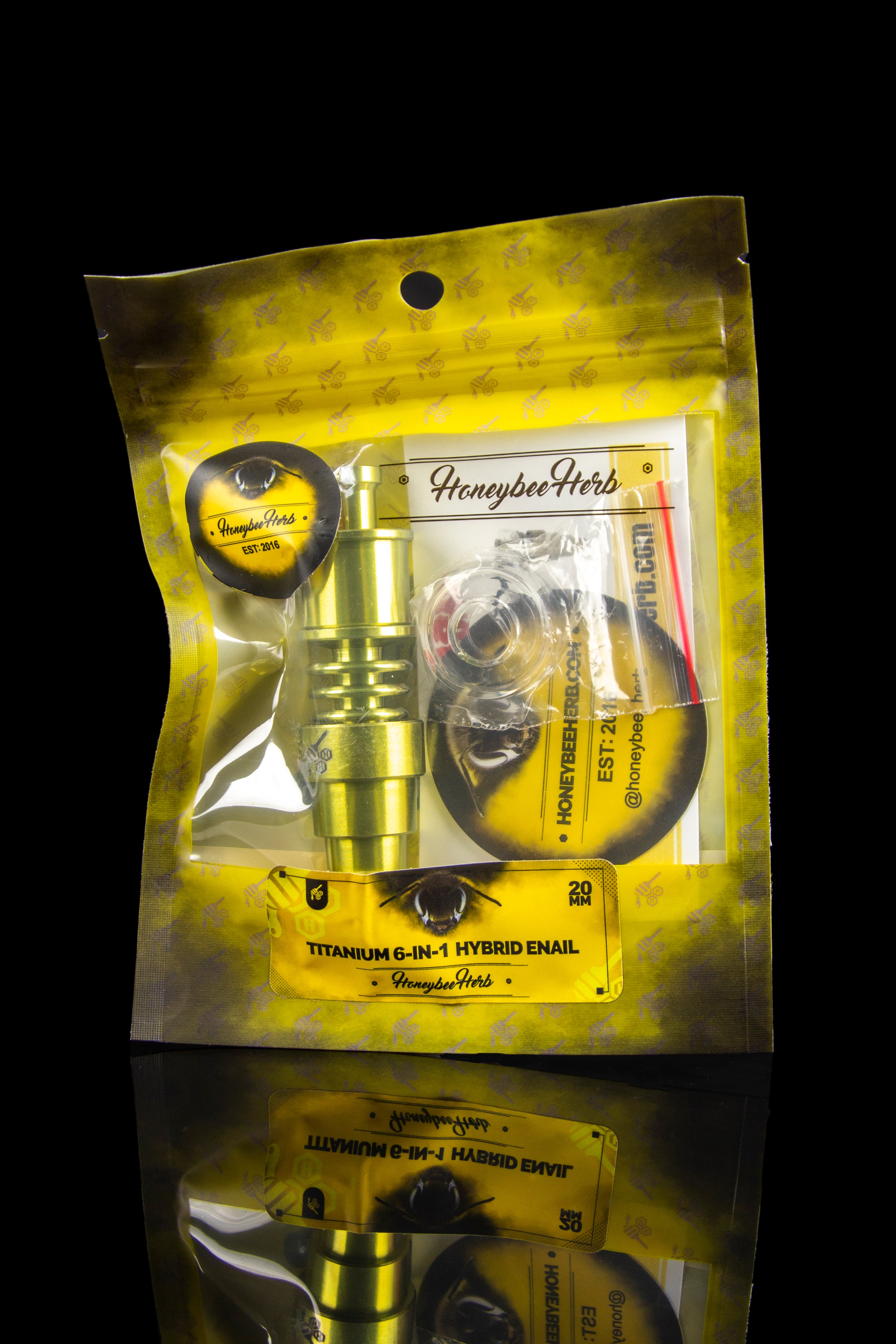 A sealed, yellow foil bag for “Honeybee Herb” titanium 6-in-1 hybrid enail with a graphic of a bee wearing goggles.