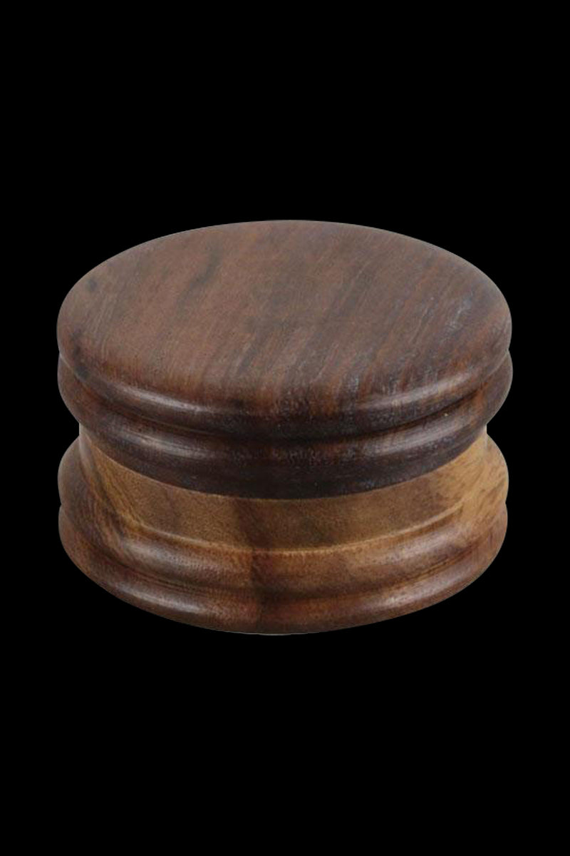 Top-down view of the round Wood Grinder - Ben Franklin showing its two-piece dark brown polished wooden body against a black background