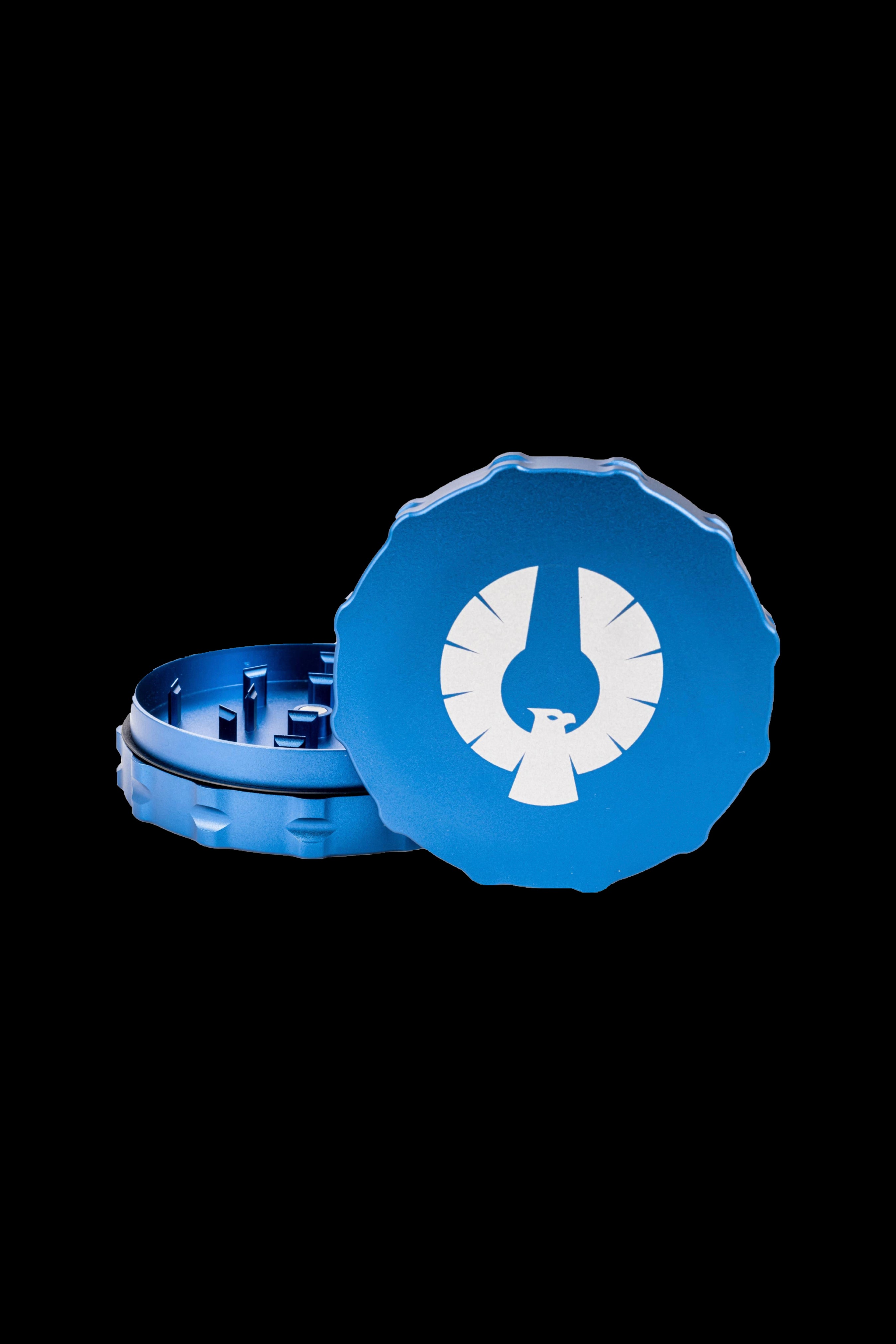 Blue cannabis grinder with a white phoenix logo.