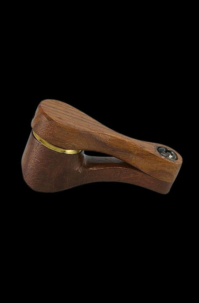 Angled side view of a wooden swivel pipe, showing the warm grain, brass hinge and bowl set against a black background.