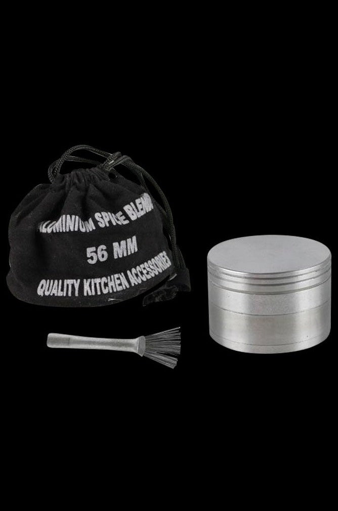 A close-up, angled view of the Metal 4-Piece Grinder, showcasing its cylindrical, multi-tiered metal construction.