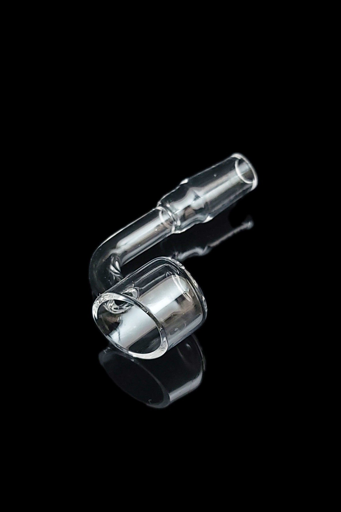 Clear glass dab rig component against a black background.