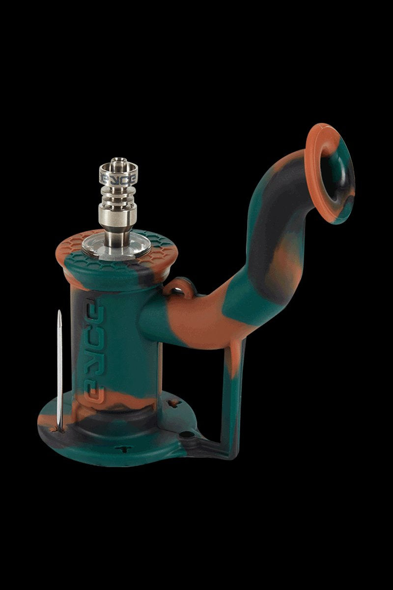 Angled front view of the EYCE Rig II Silicone Bong in coral snake colors, showing its curved mouthpiece, textured top and metal nail.