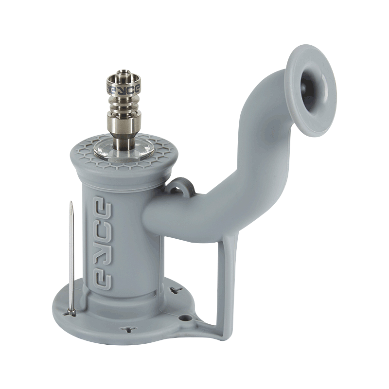 Angled studio view of the pink EYCE Rig II Silicone Bong showing its curved mouthpiece, textured top cap, metal nail, and raised EYCE logo.